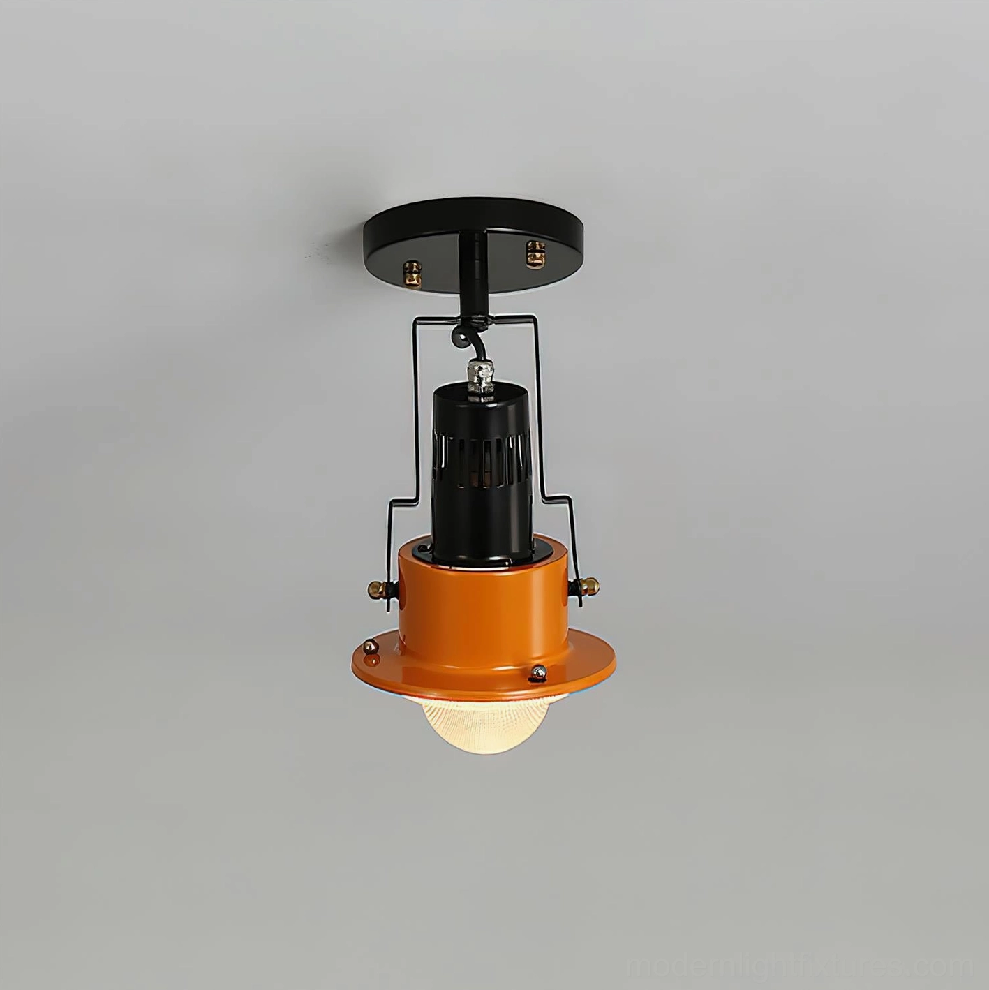 Compact modern ceiling light fixture with enclosed bulb, minimalist black metal frame, geometric aesthetic