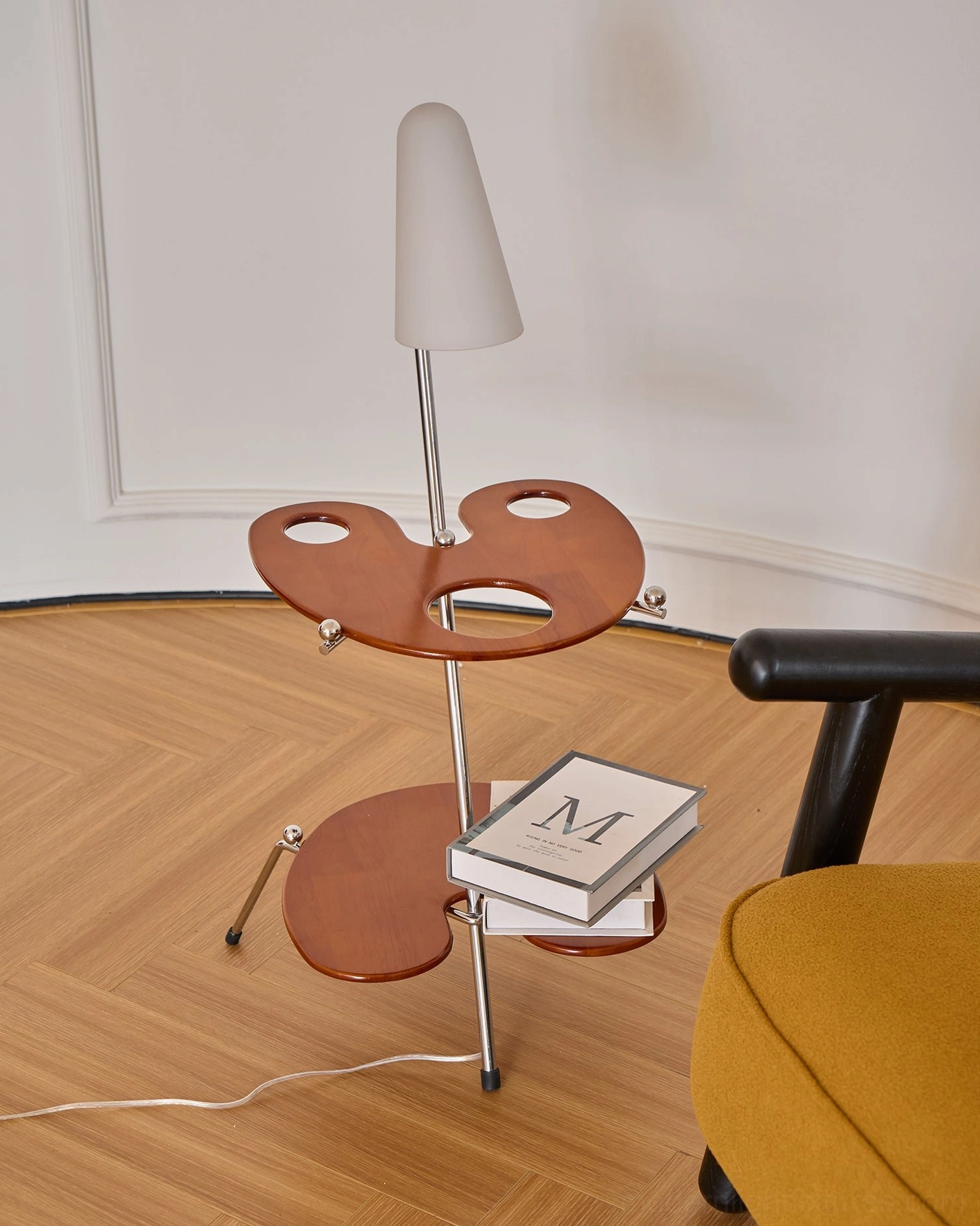 Contemporary floor lamp with dual-tiered wood storage displaying home decor in compact apartment living room