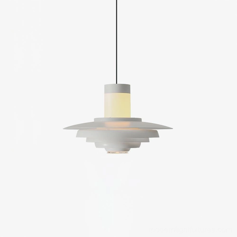 Compact geometric tiered pendant light in matte white finish demonstrating layered metal construction and contemporary Nordic design inspiration
