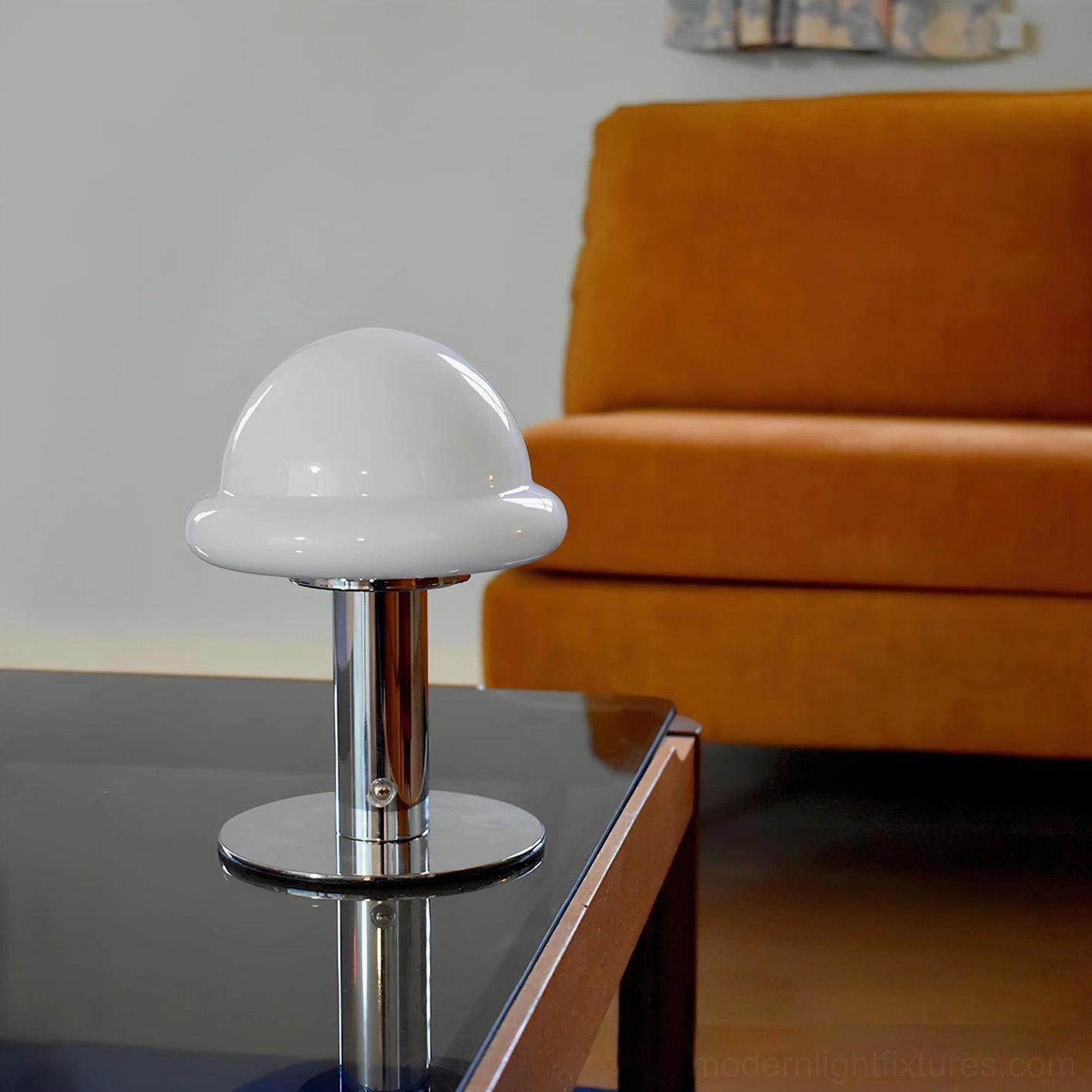 Compact mushroom cordless table lamp on reading table with books demonstrating space-efficient lighting solution