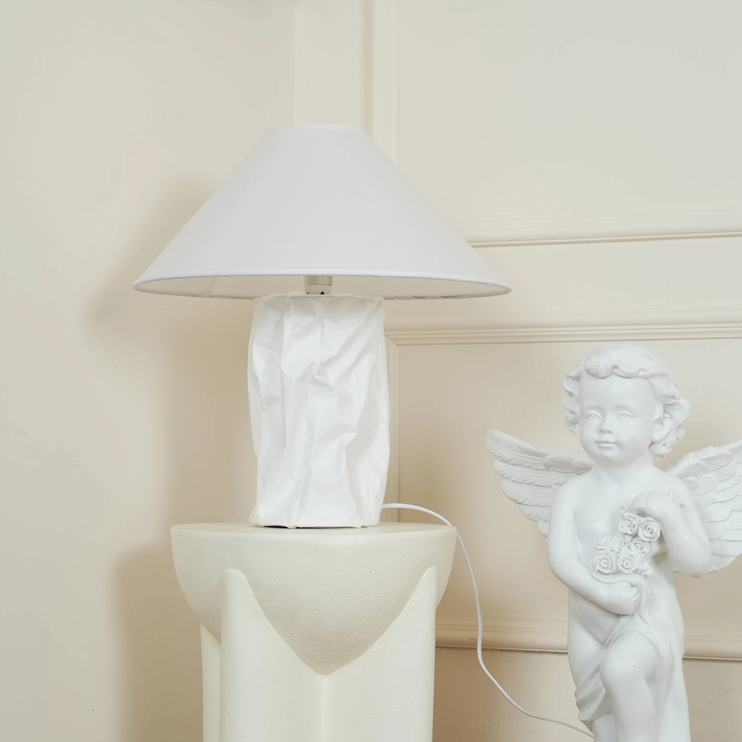 Compact 50cm table lamp creating warm ambient lighting on contemporary side table