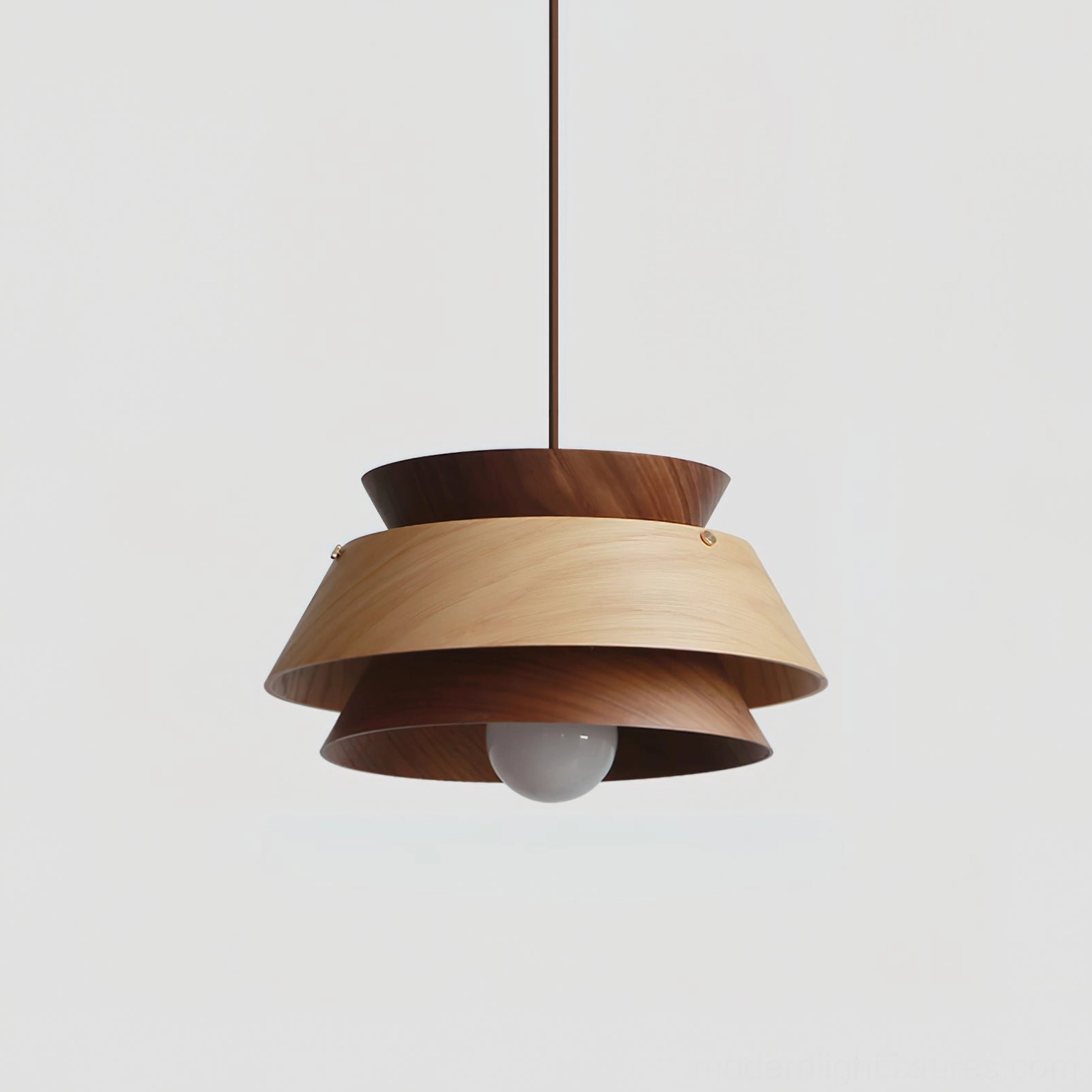 Compact tiered wood pendant lamp Model C in Scandinavian interior with minimalist furniture and décor