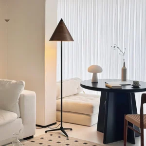 Minimalist wooden cone floor lamp in contemporary dining room with warm neutral décor and modern furniture