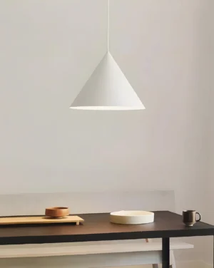 White cone pendant light suspended over dining workspace, Nordic minimalist interior design