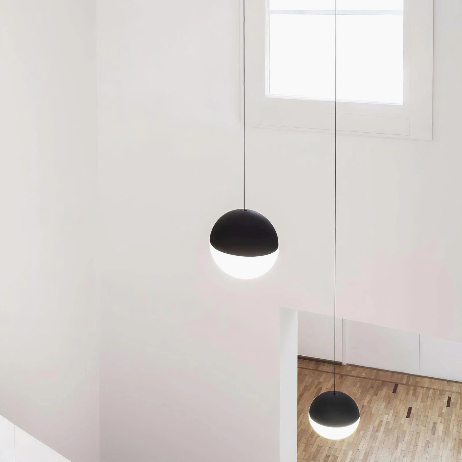Cone pendant light with exposed cable design detail, industrial minimalist metal fixture, close-up view of shade construction