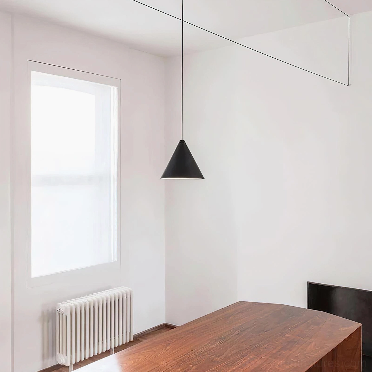 Modern cone pendant light installation showing adjustable cable height, hardwired metal fixture with minimalist aesthetic
