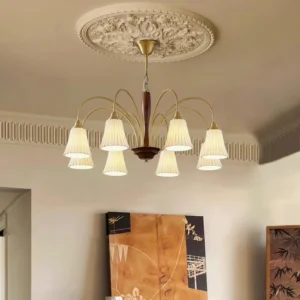 Six-arm pleated shade chandelier installed in residential living room with ornate ceiling medallion mid-century modern design