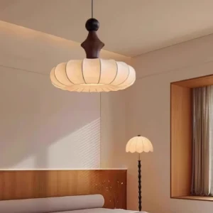 Coniko fabric ceiling lamp installed above bed in warm bedroom with mid-century modern décor and soft lighting