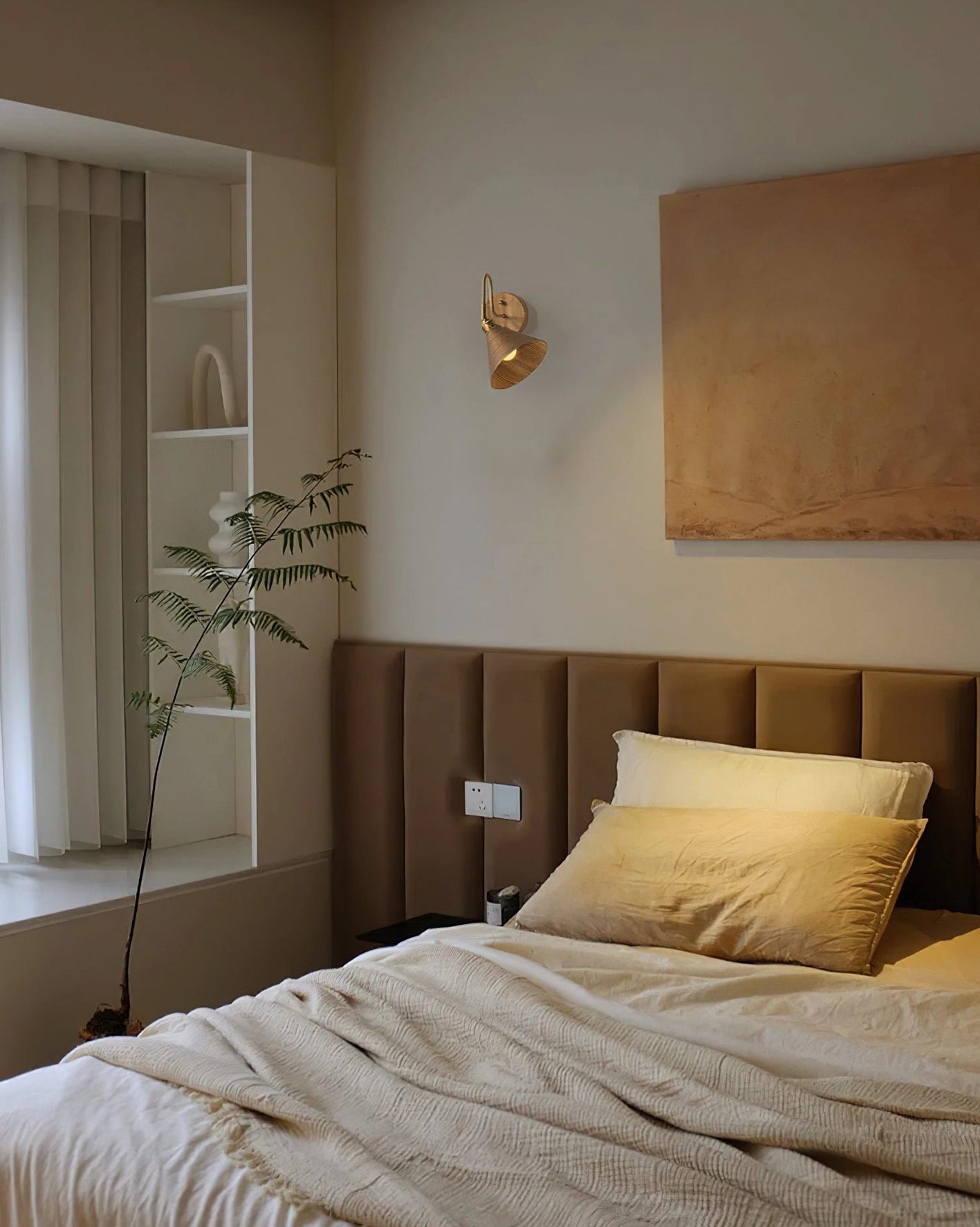 Compact Conira wall lamp accent fixture in modern bedroom interior design setup