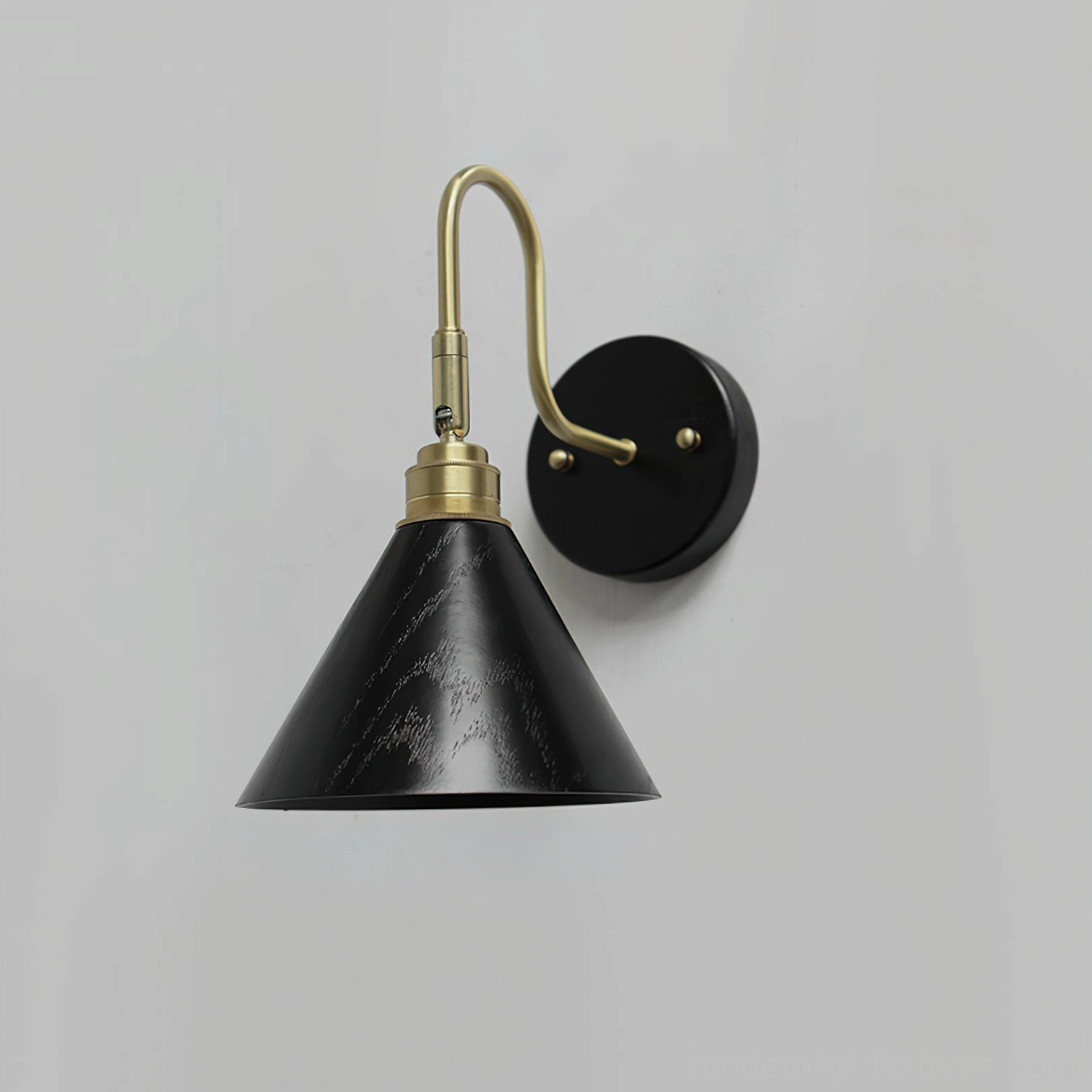 Conira wall sconce in brass and black finish - modern minimalist contemporary style