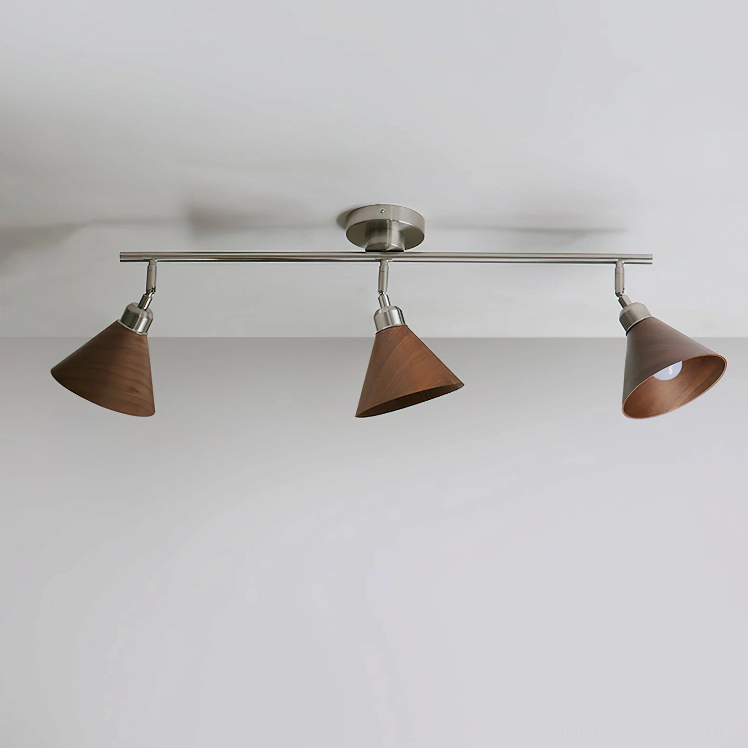 Conistra 3-head track ceiling light fixture overhead flat view showing dark brown conical lamp covers and minimalist design