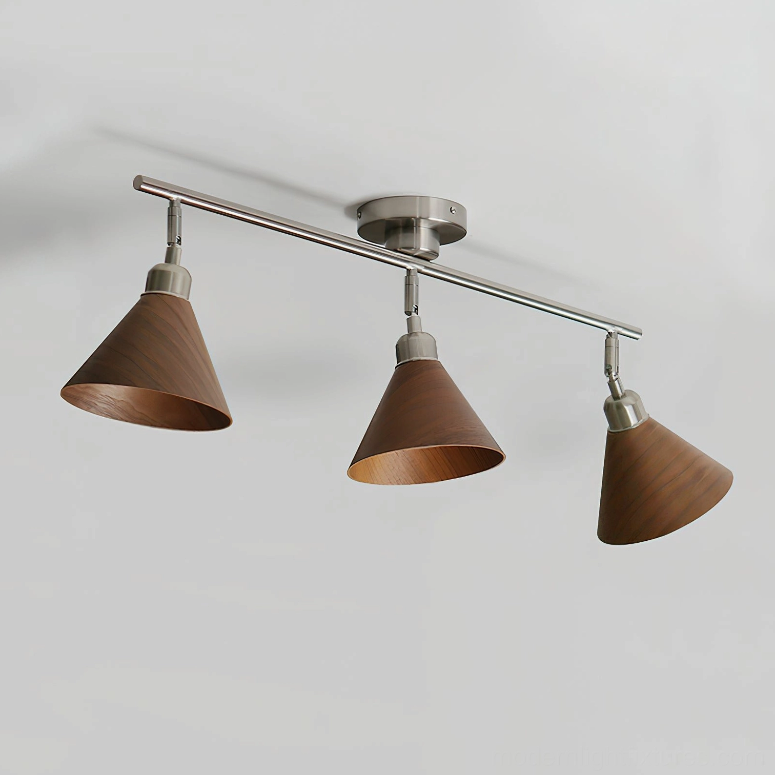Conistra 3-light ceiling light fixture detail shot showing conical shade design and adjustable directional head configuration