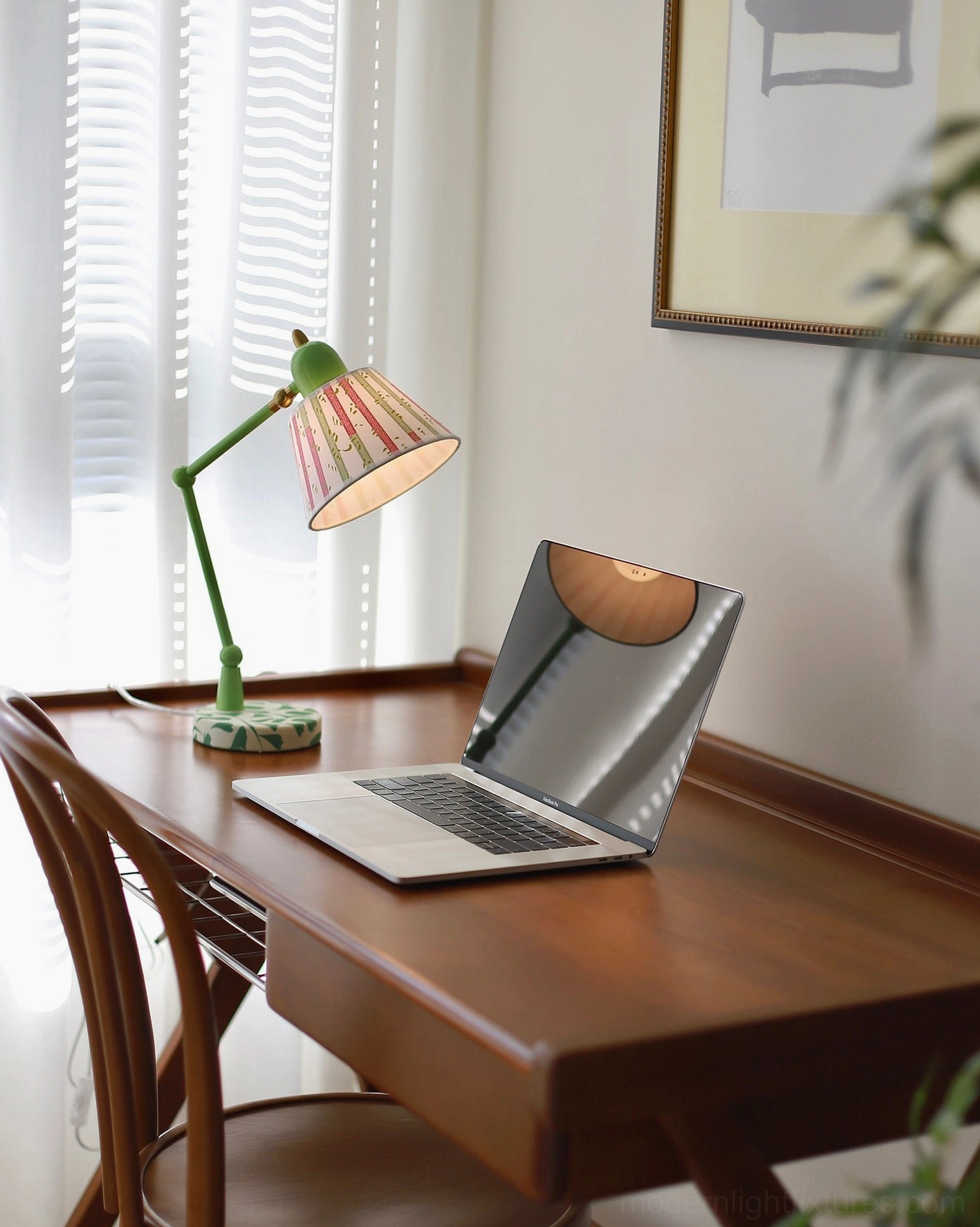 Contemporary adjustable table lamp with green articulated arm and hand-painted brush stroke fabric shade