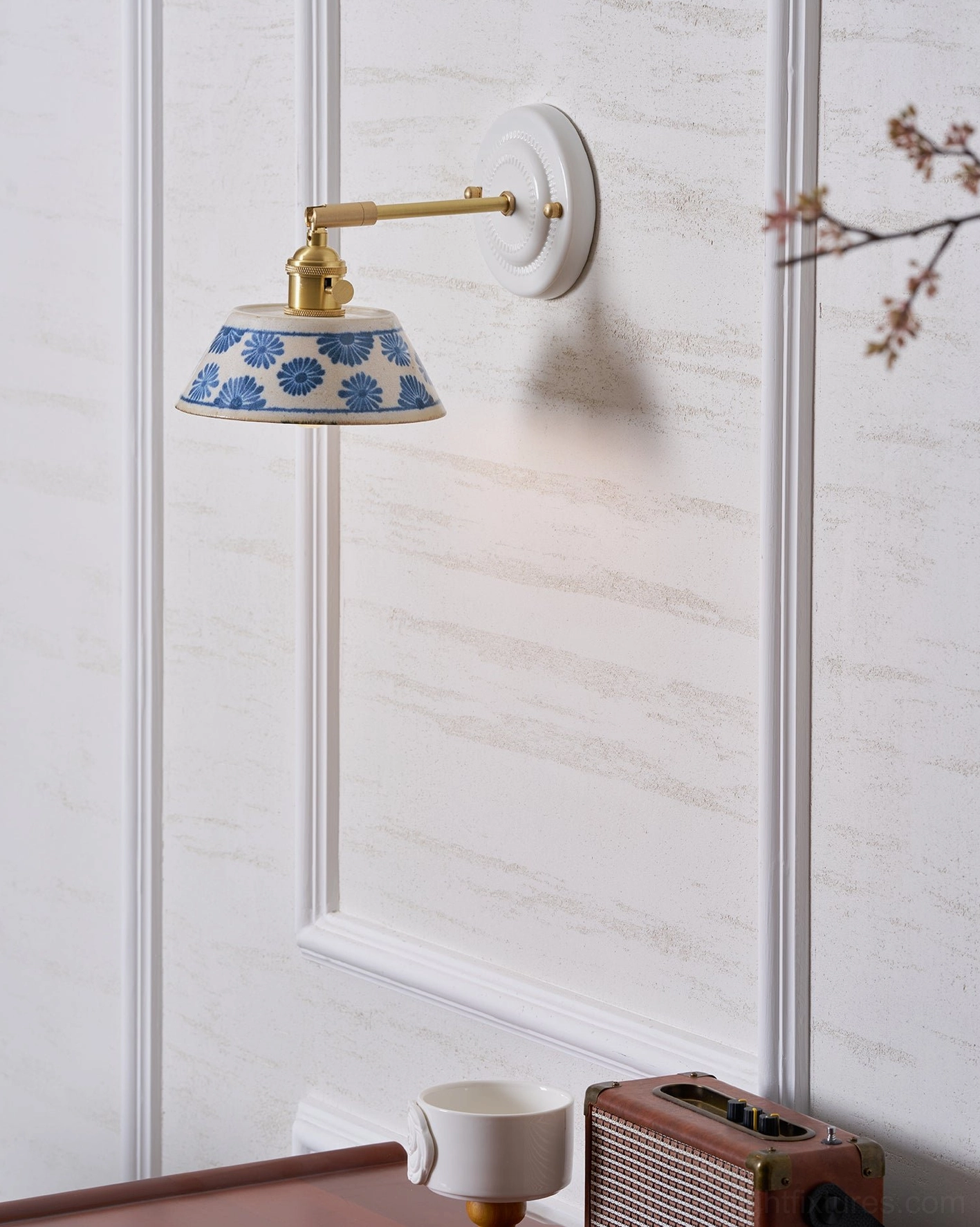 Contemporary wall lamp with artisan hand-glazed ceramic shade and brass fixture