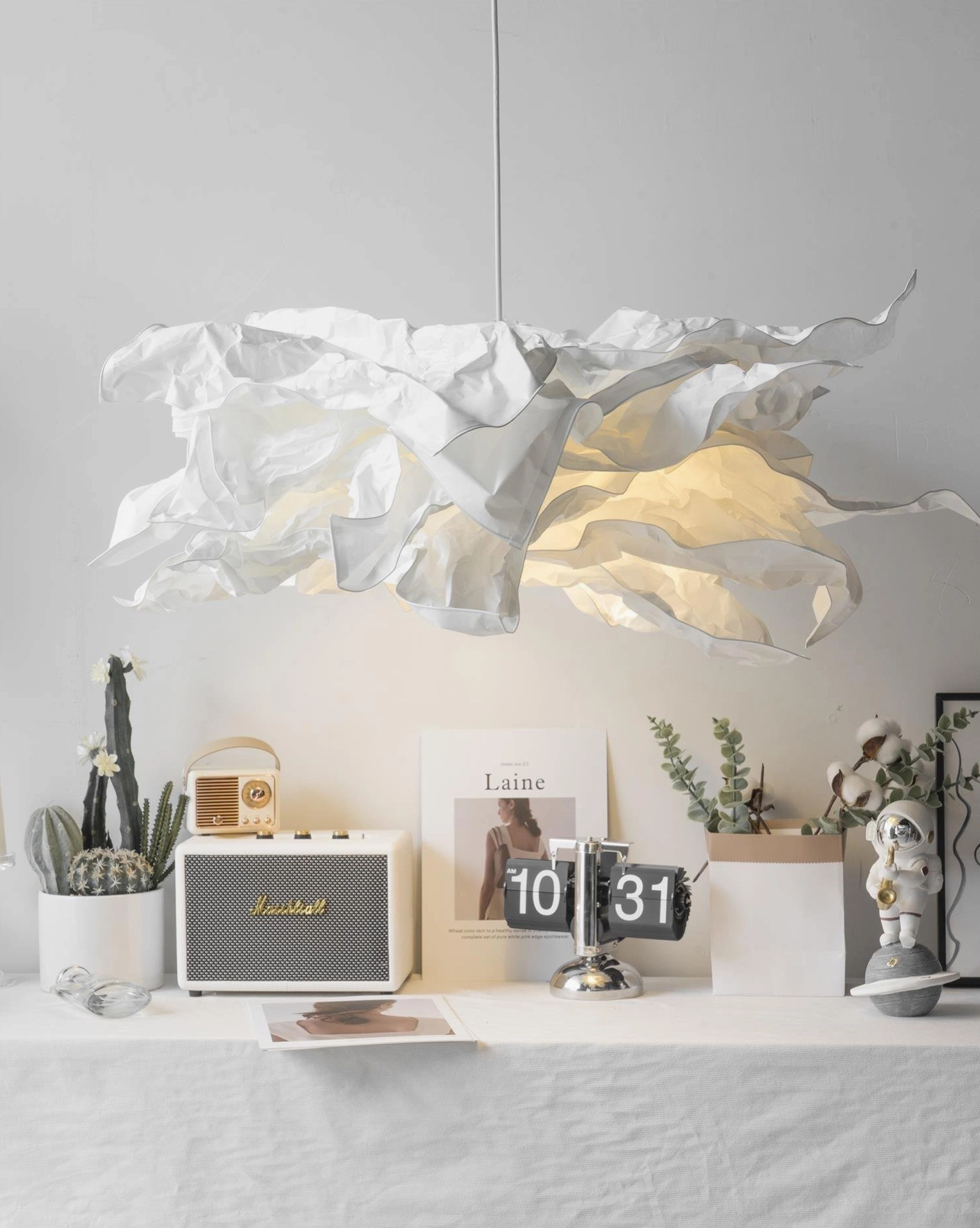 Sculptural paper pendant lamp bringing contemporary artistic flair to residential dining space