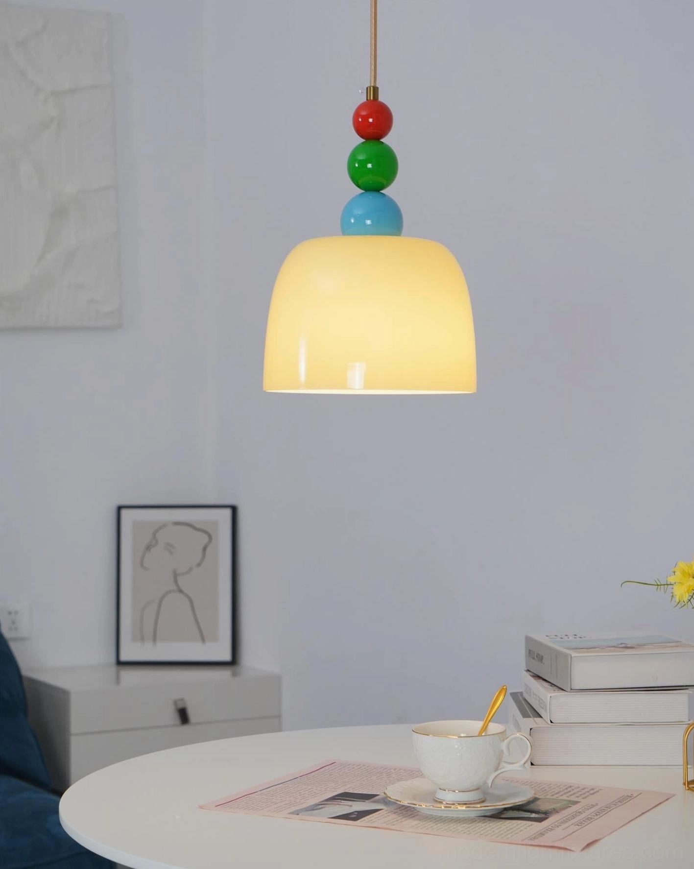 Contemporary beaded pendant light showcasing artistic glass bead arrangement detail