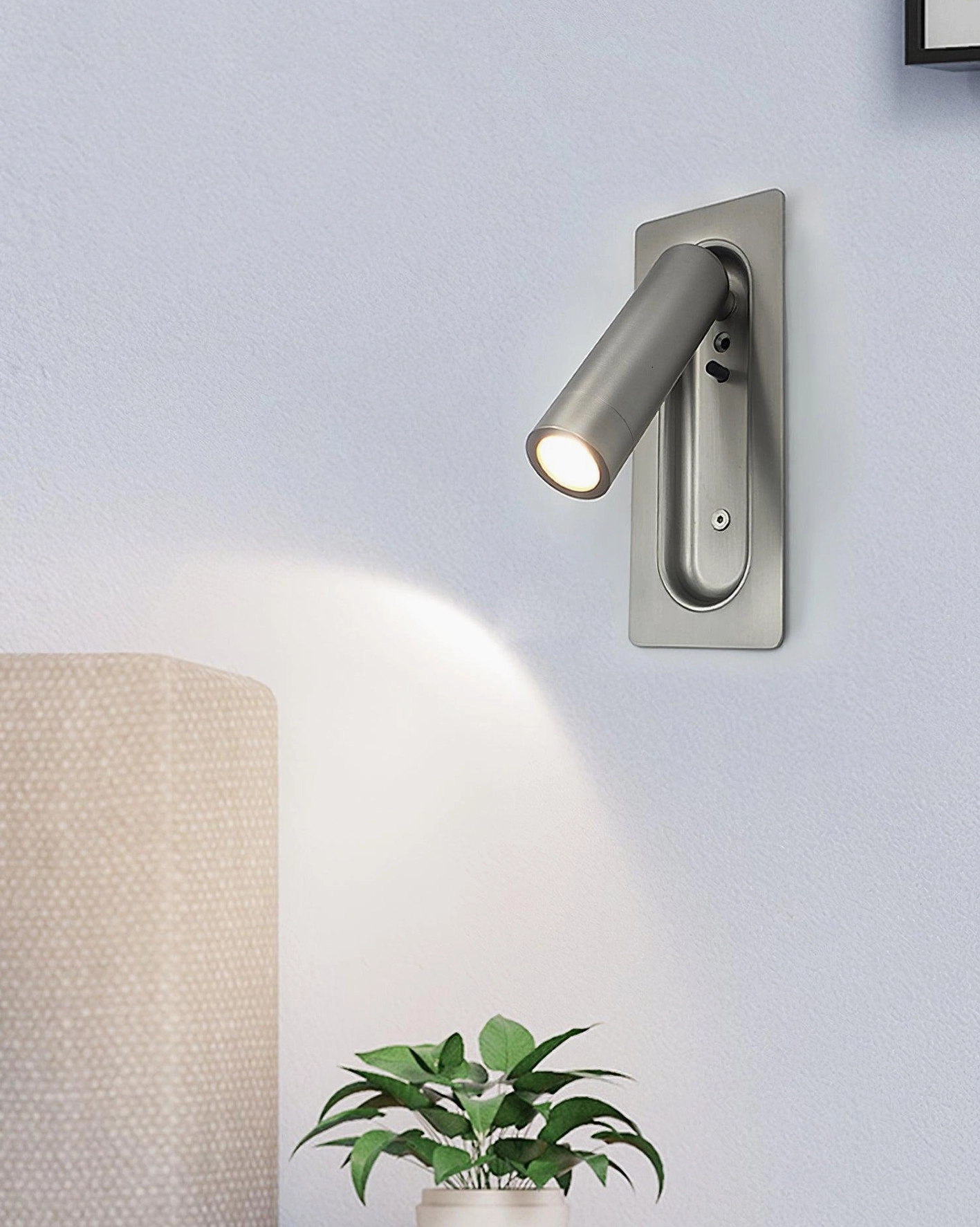 Bedroom interior design featuring matte finish recessed wall lamp complementing contemporary furniture and neutral palette