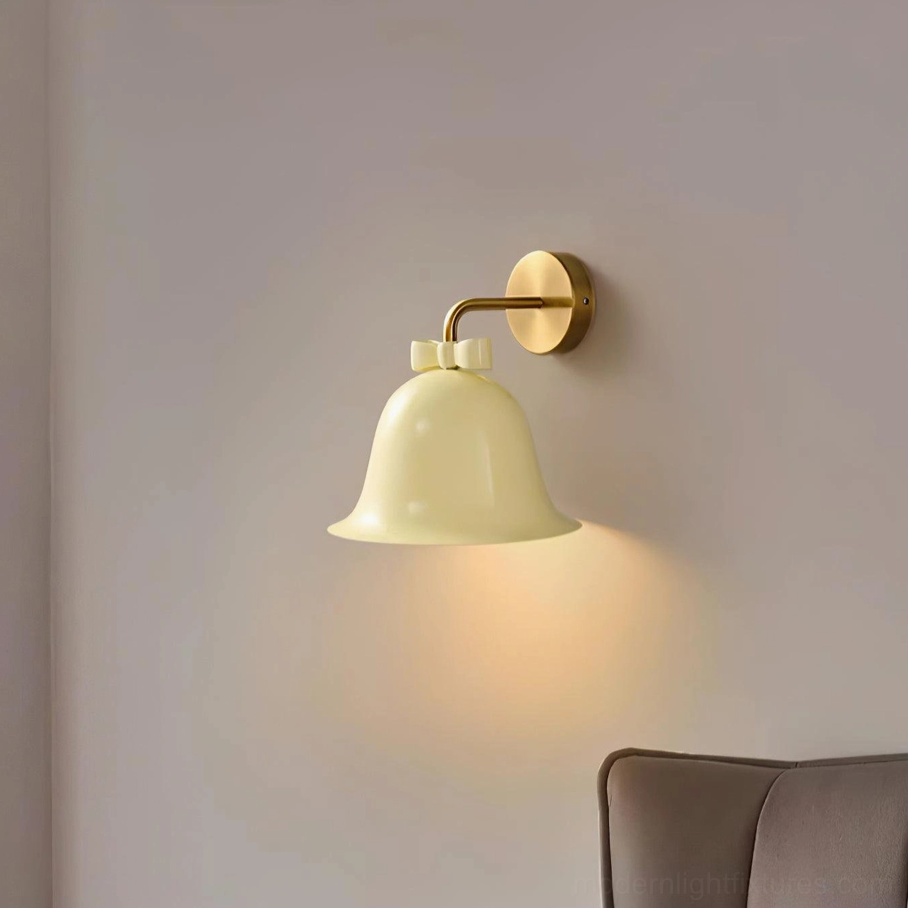 Contemporary bell-shaped ceramic wall sconce with minimalist design and warm brass hardware