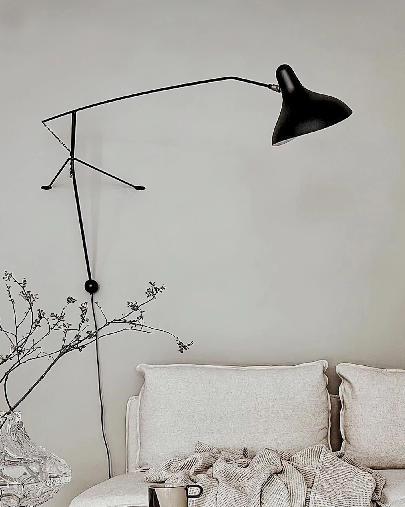 Matte black wall-mounted articulating sconce contemporary design detail