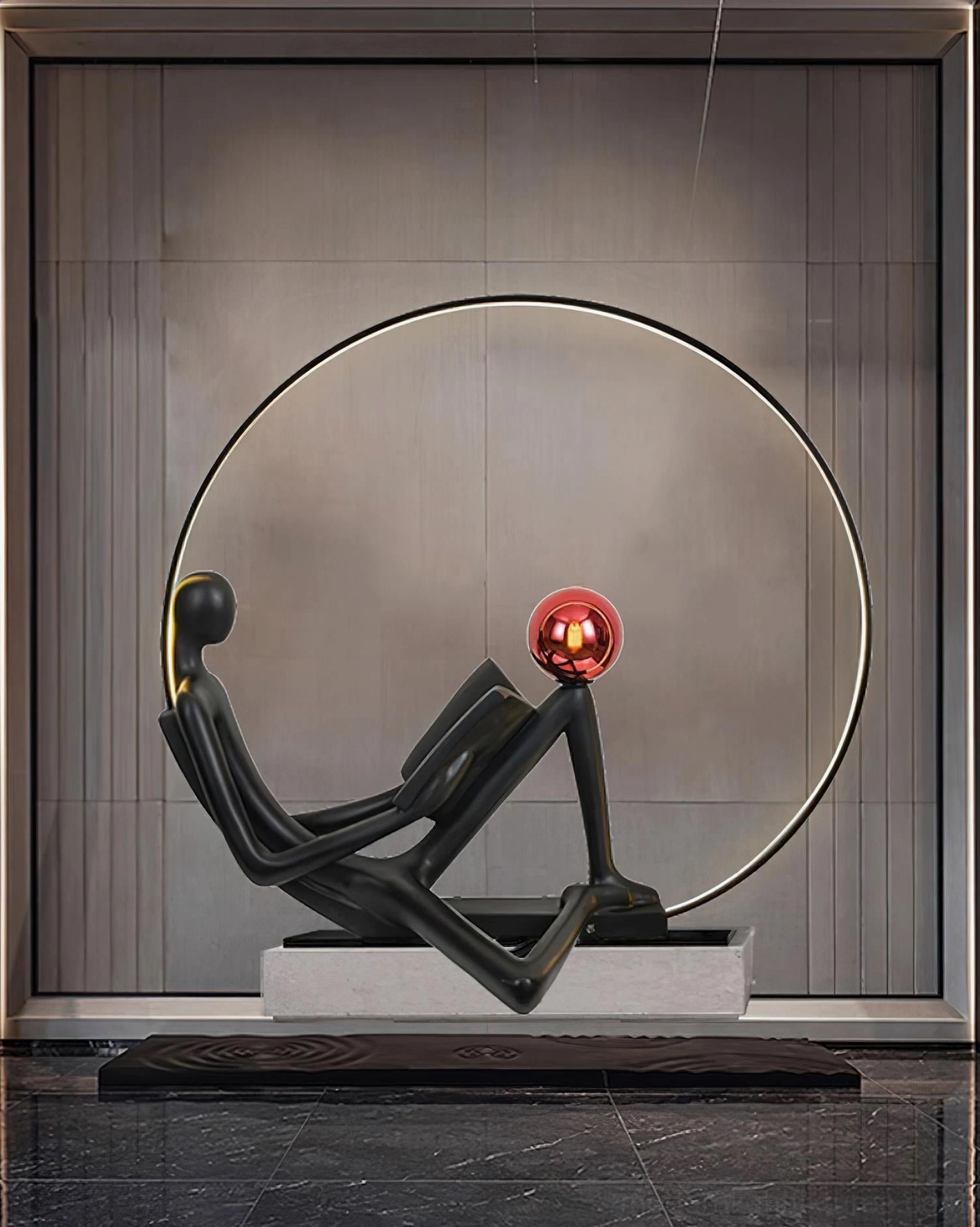 Contemporary sculptural reading floor lamp with matte black finish and glossy red sphere, warm ambient lighting