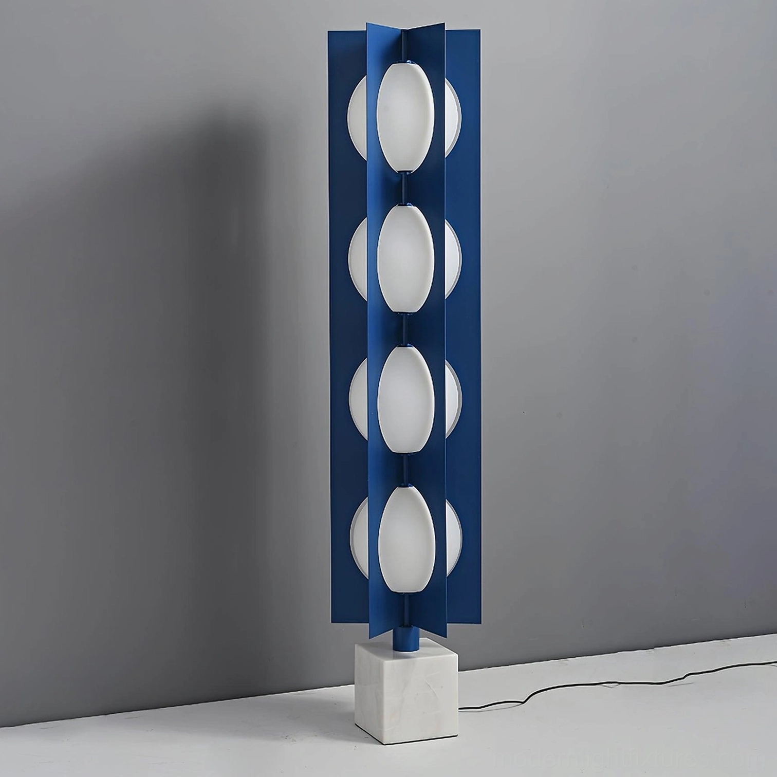 Blue metal frame floor lamp unlit showing marble base and geometric sphere design side view