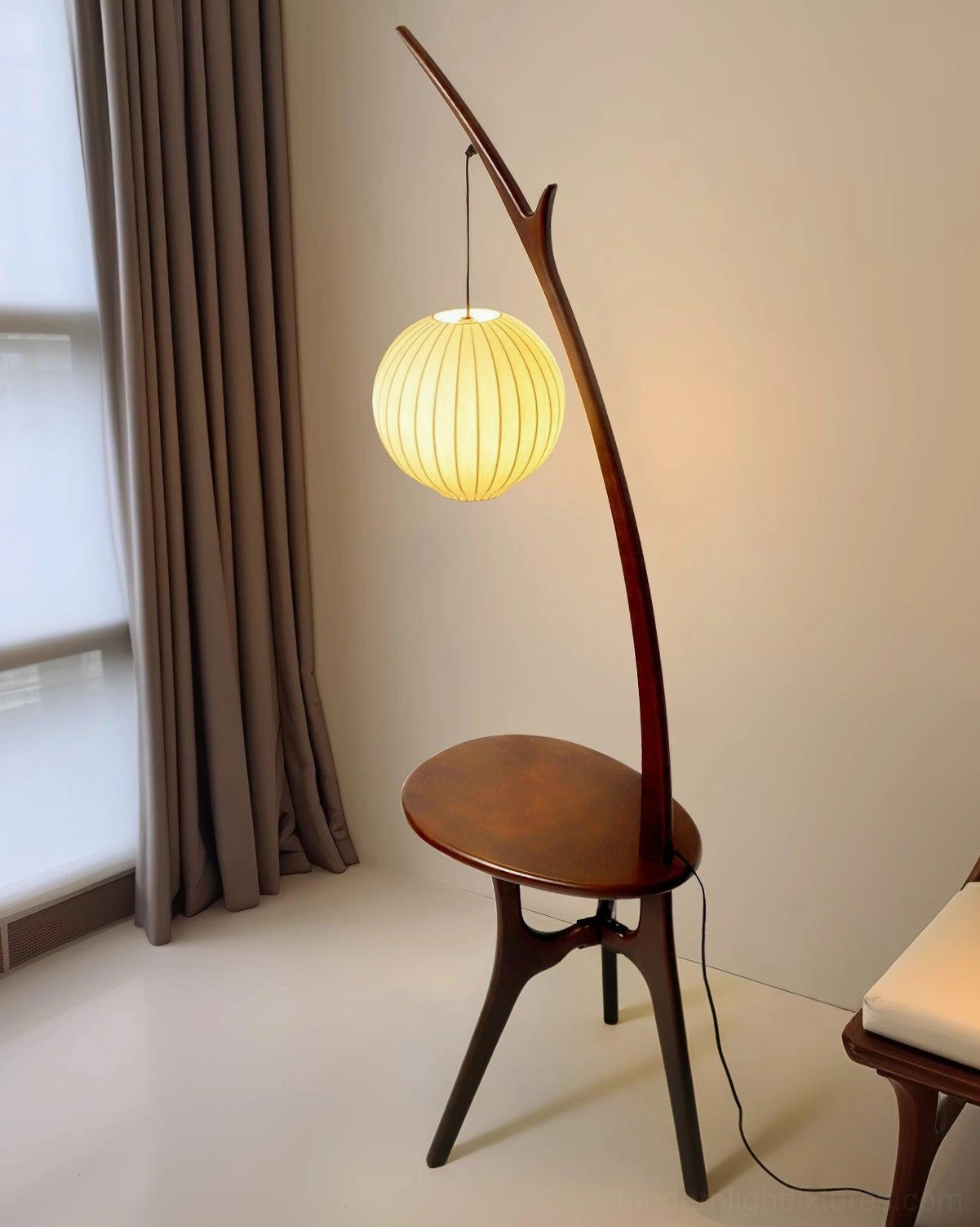 Contemporary branch-style floor lamp with fabric lampshade and side table three-quarter view