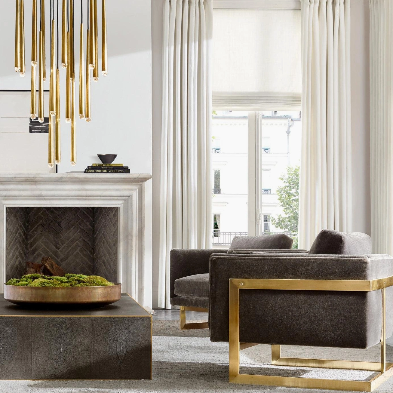 Round tapered rod pendant light fixture in elegant fireplace lounge setting