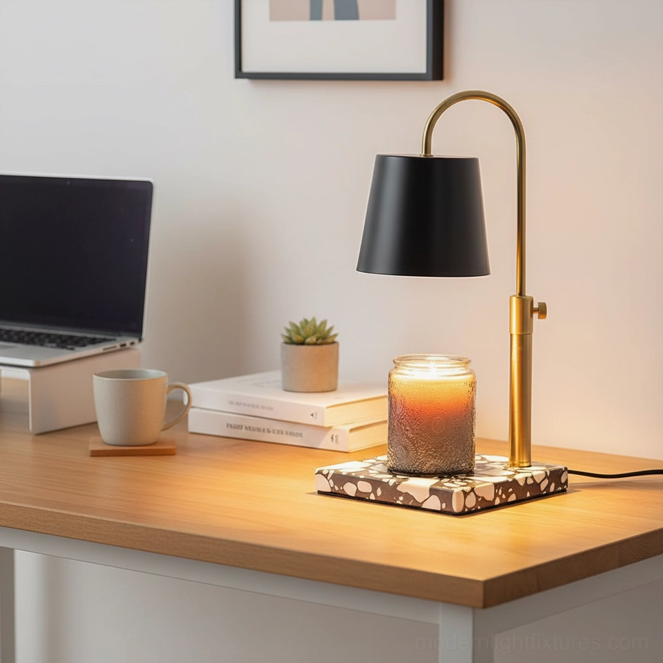 Modern candle warmer lamp black shade brass gold adjustable arm patterned terrazzo base wooden desk three-quarter view