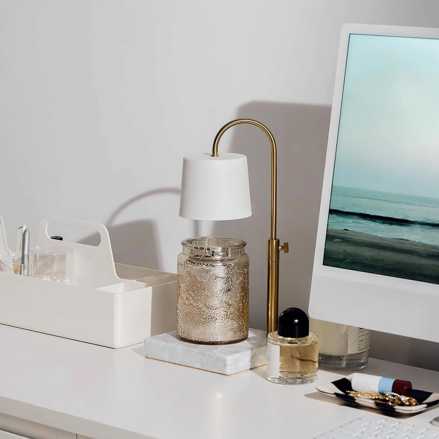 Contemporary table lamp candle warmer with fabric shade and sculpted brass gold arc arm