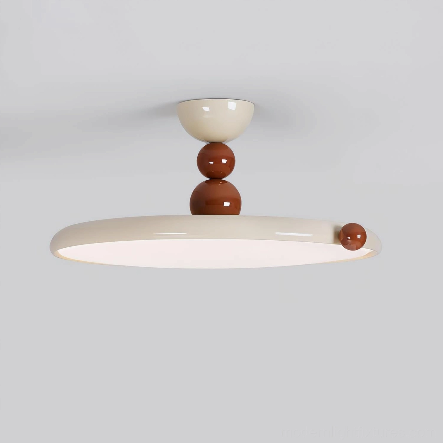Side front low-angle view of modern ceiling light fixture displaying stacked brown spherical hardware on metal body