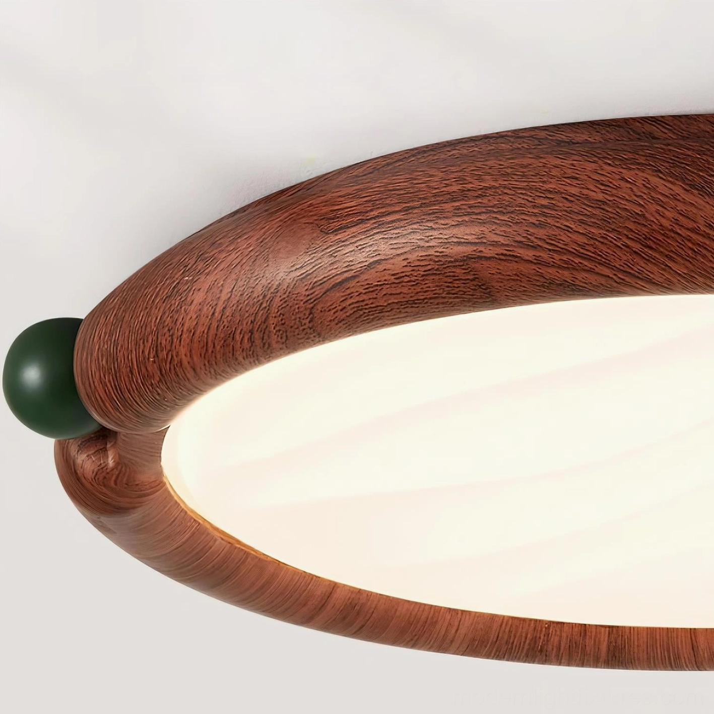 Contemporary round ceiling light fixture design detail, artistic green accent balls