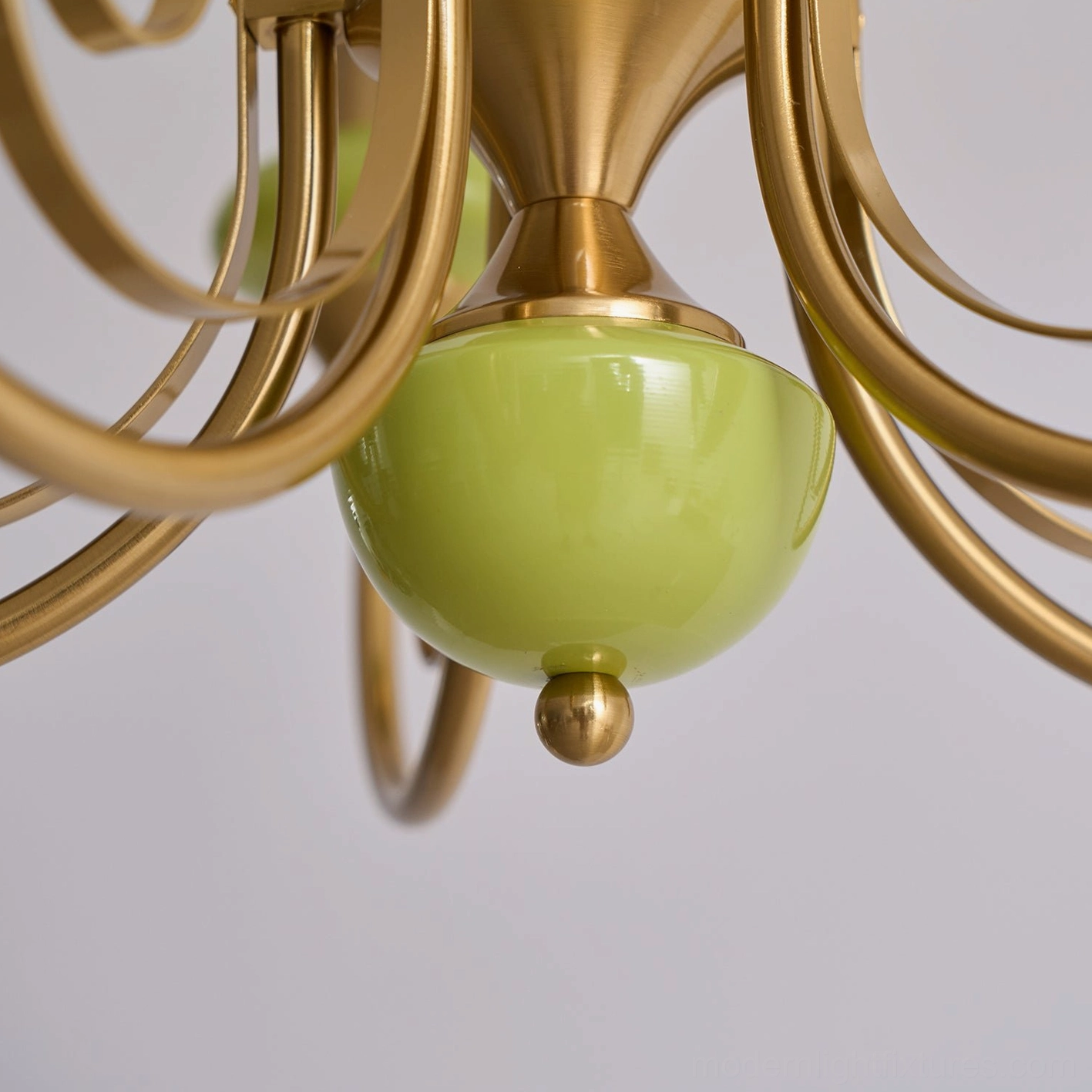 Contemporary chandelier with frosted glass shades and decorative metallic arms
