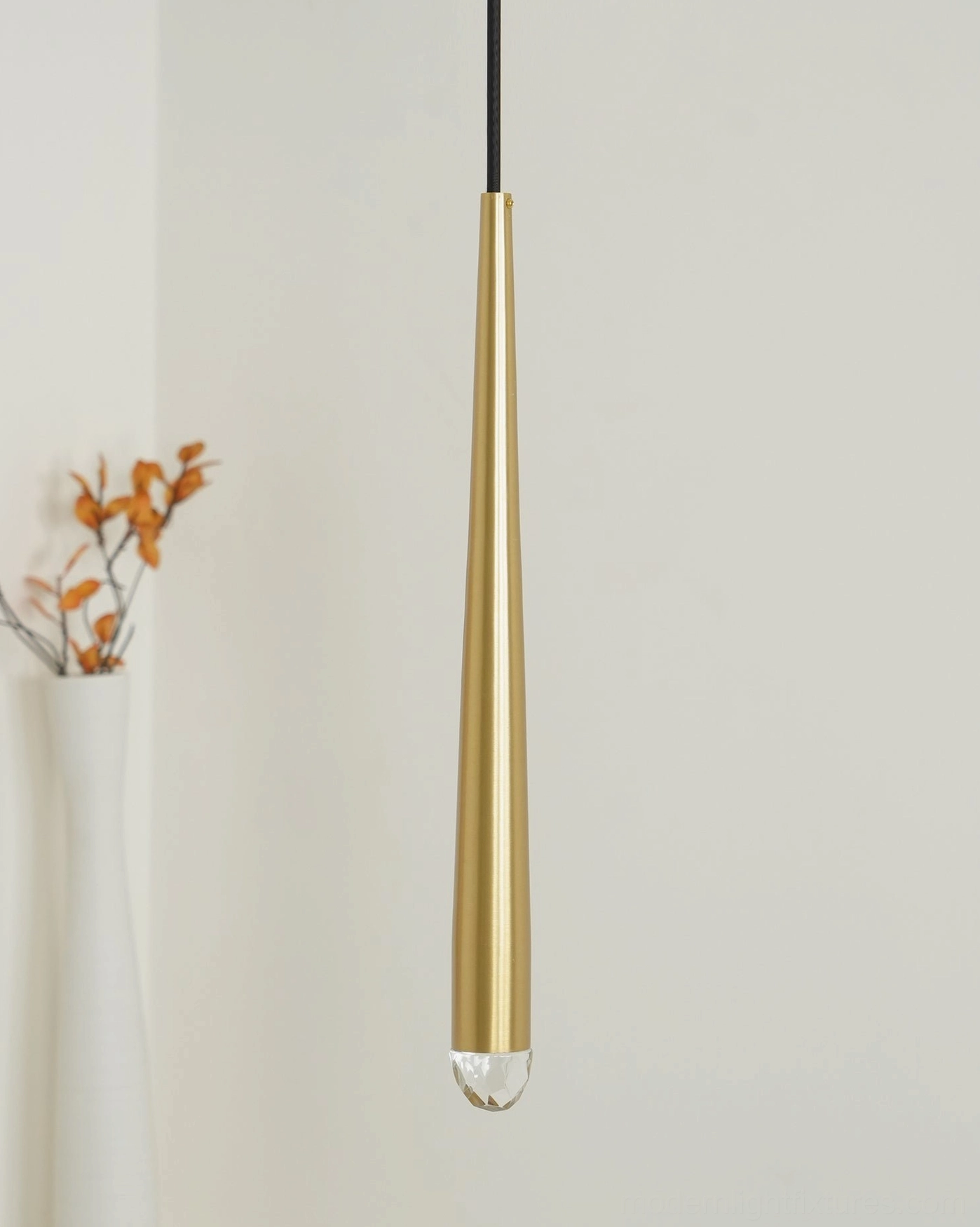 Contemporary cluster pendant light suspended from black cords