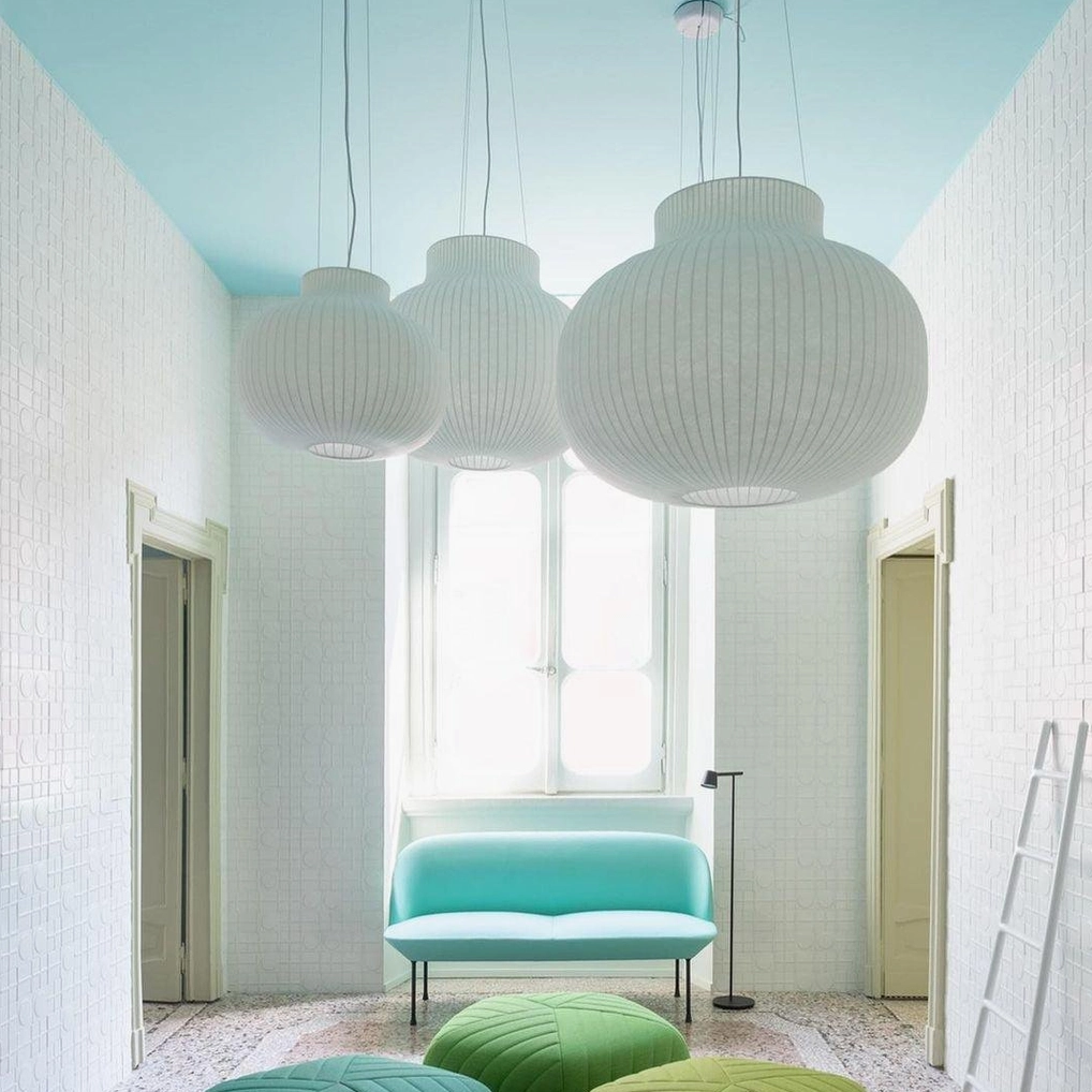 Contemporary pendant light with textured cocoon-inspired shade in modern home interior