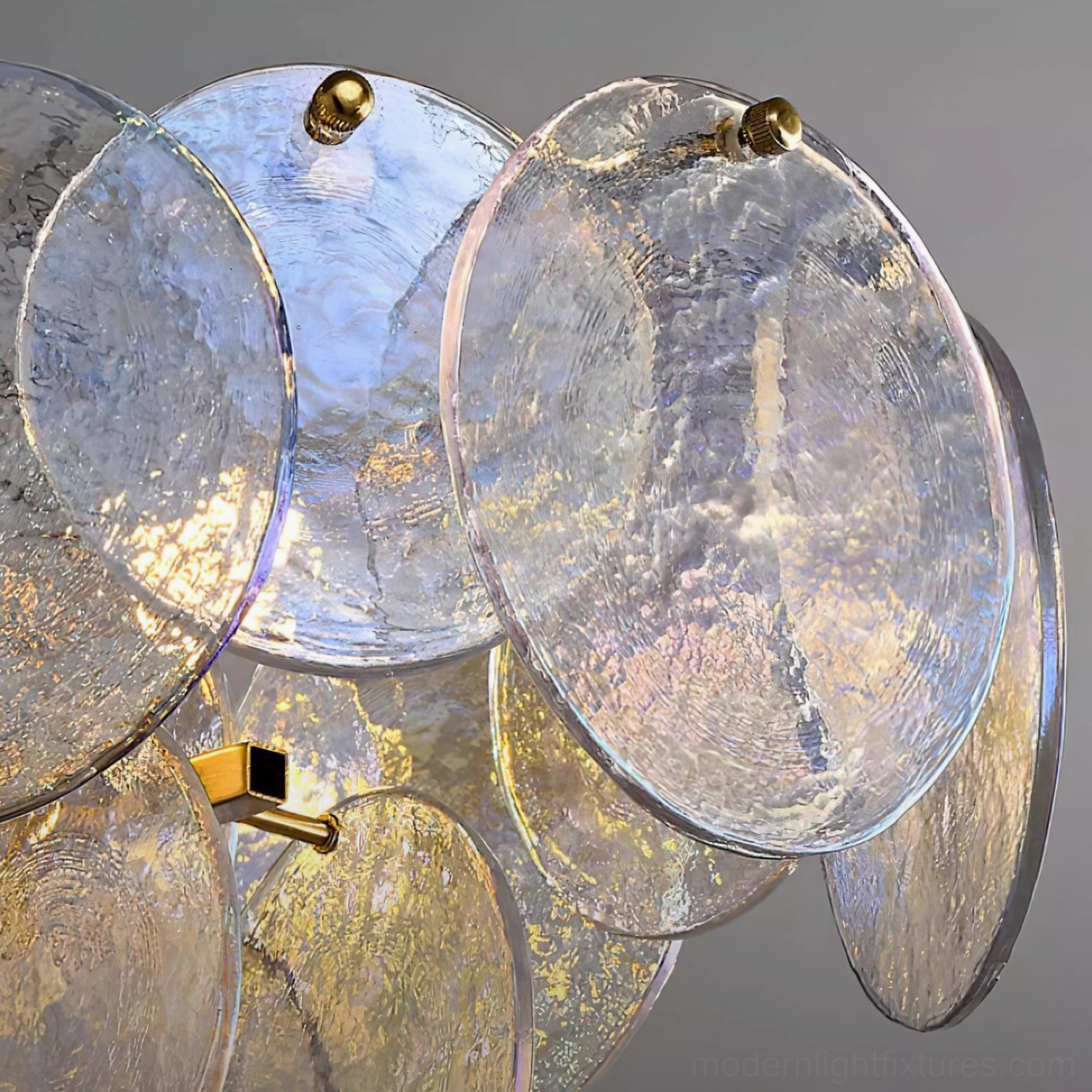 Contemporary disc pendant chandelier with iridescent textured glass and brass accents luxury design