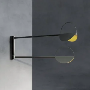 Contemporary wall sconce pair installed on corner walls showcasing minimalist geometric design and mixed metal finishes