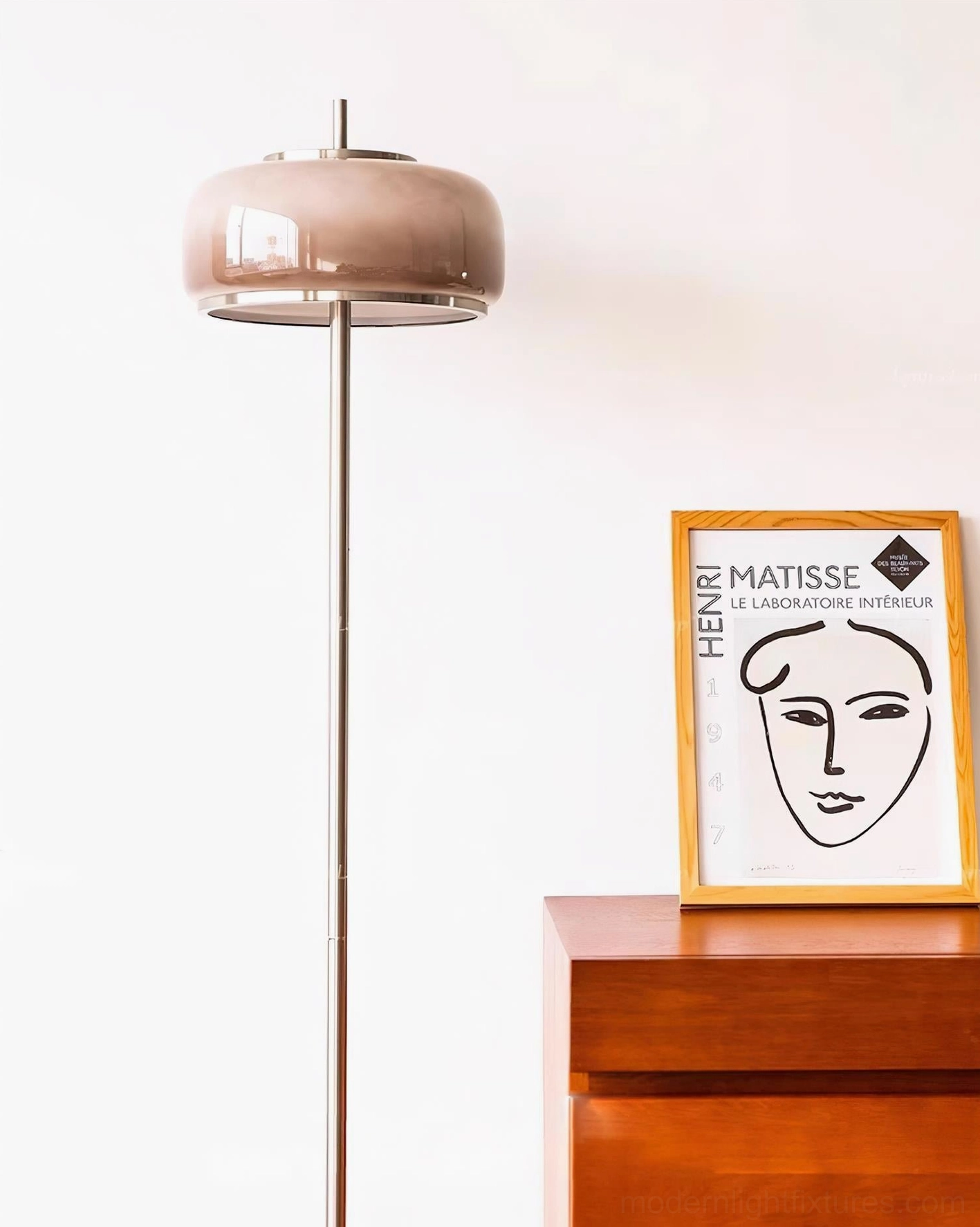 Contemporary floor lamp showing foot switch control and chrome metal construction with black marble base