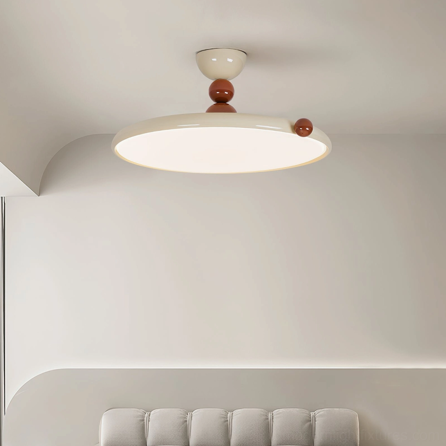 Wide low-angle view of contemporary disc ceiling lamp in living room with fabric sofa, warm neutral minimalist home setting