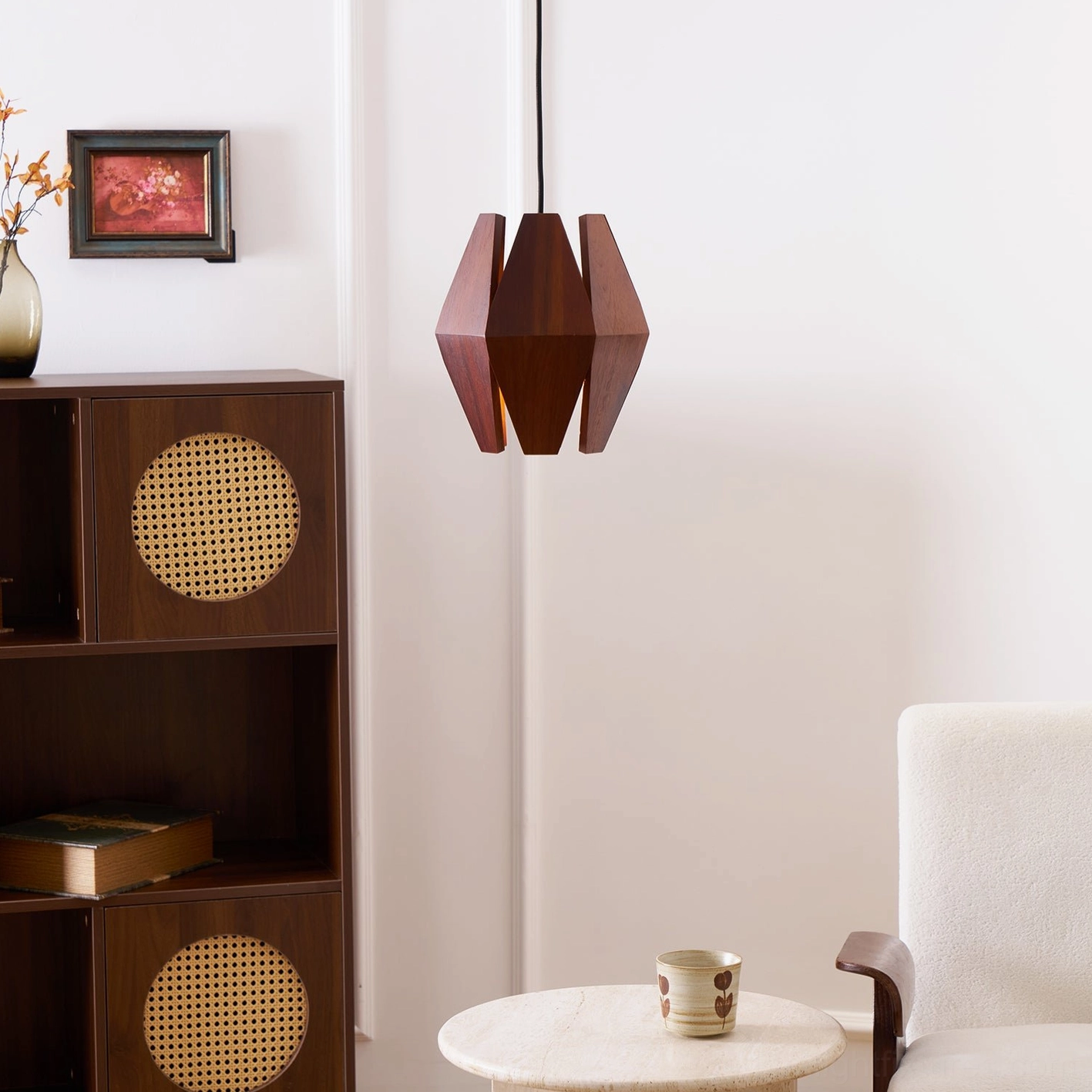 Contemporary wood pendant light fixture showcasing sculptural walnut shade design