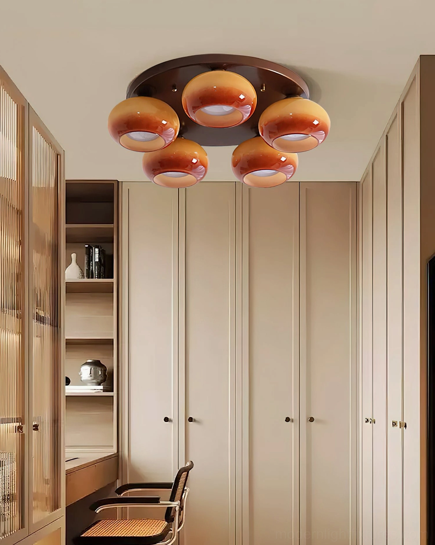 Contemporary glass ceiling pendant fixture demonstrating ambient lighting performance in interior space