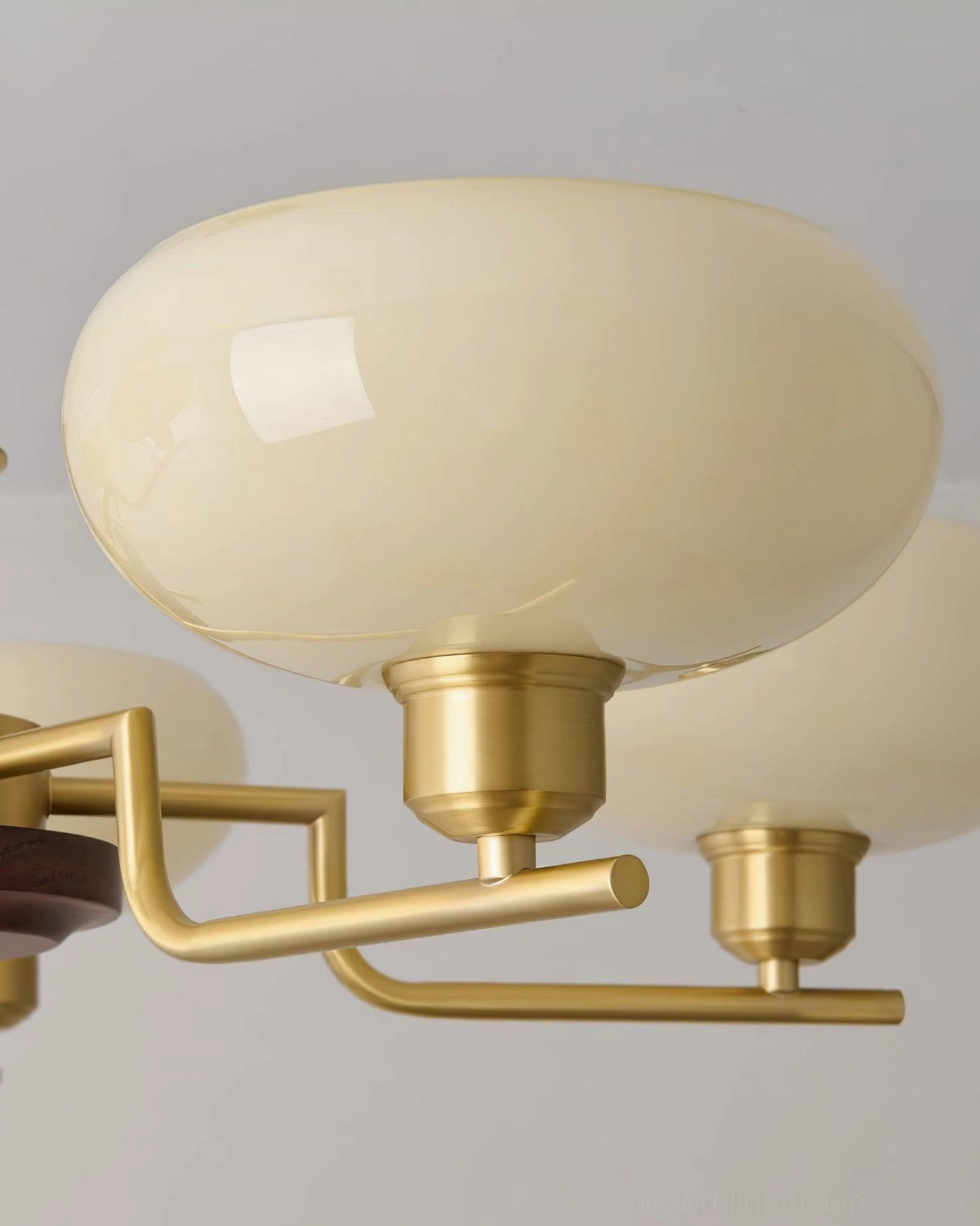 Contemporary glass pendant light fixture showing warm ambient lighting effect in modern home interior setting