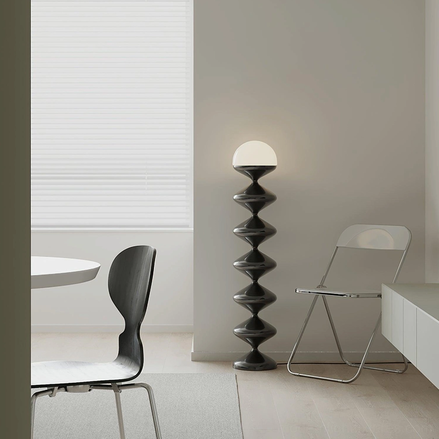 Modern gourd floor lamp providing ambient illumination in contemporary dining area with minimal furniture