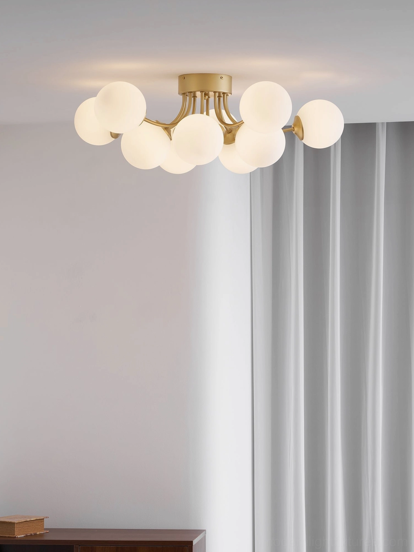 Modern sputnik ball ceiling light in contemporary home setting with mid-century design elements