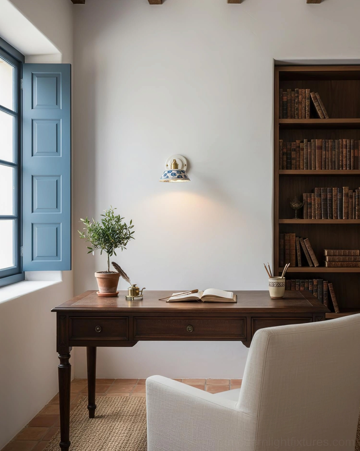 Contemporary ceramic wall sconce with traditional indigo patterns and modern minimalist form