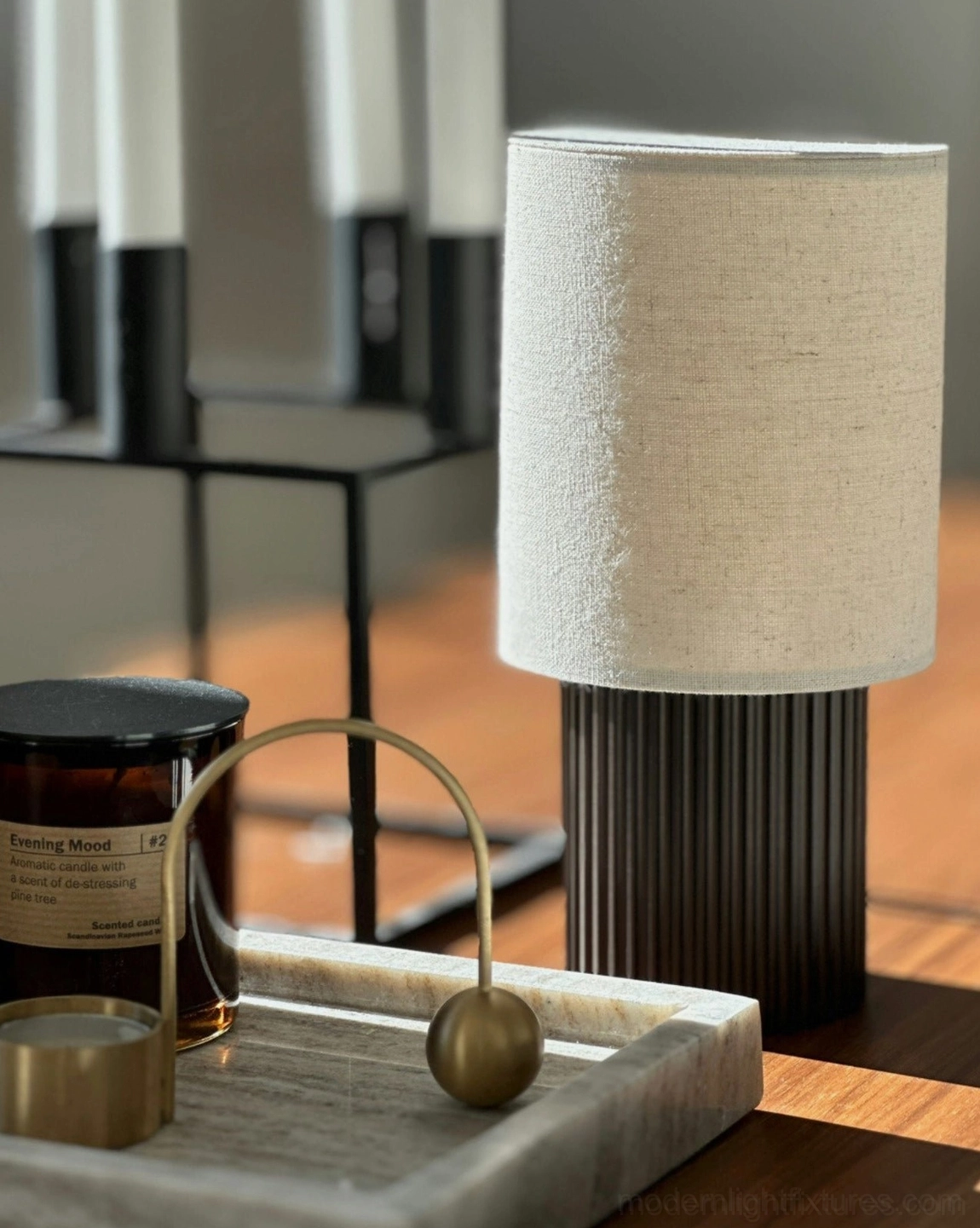 Contemporary table lamp with natural fabric shade and built-in USB charging port, artistic still-life composition emphasizing design sophistication