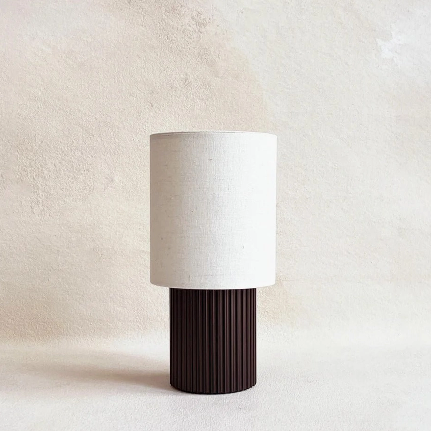 Contemporary table lamp with integrated USB charging port and LED technology, detail photography highlighting premium materials and minimalist construction