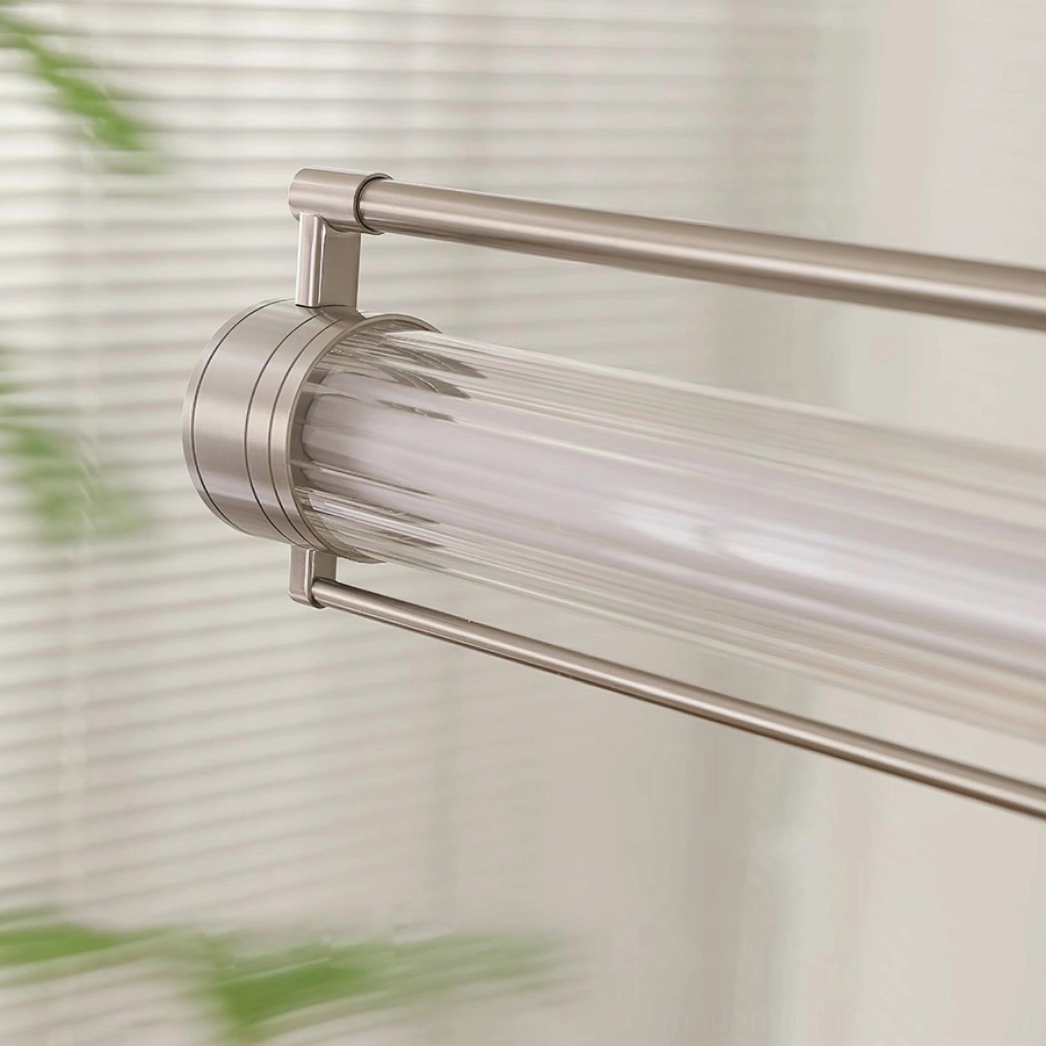 Linear LED pendant light in contemporary home setting - elongated minimalist design with polished metal accents