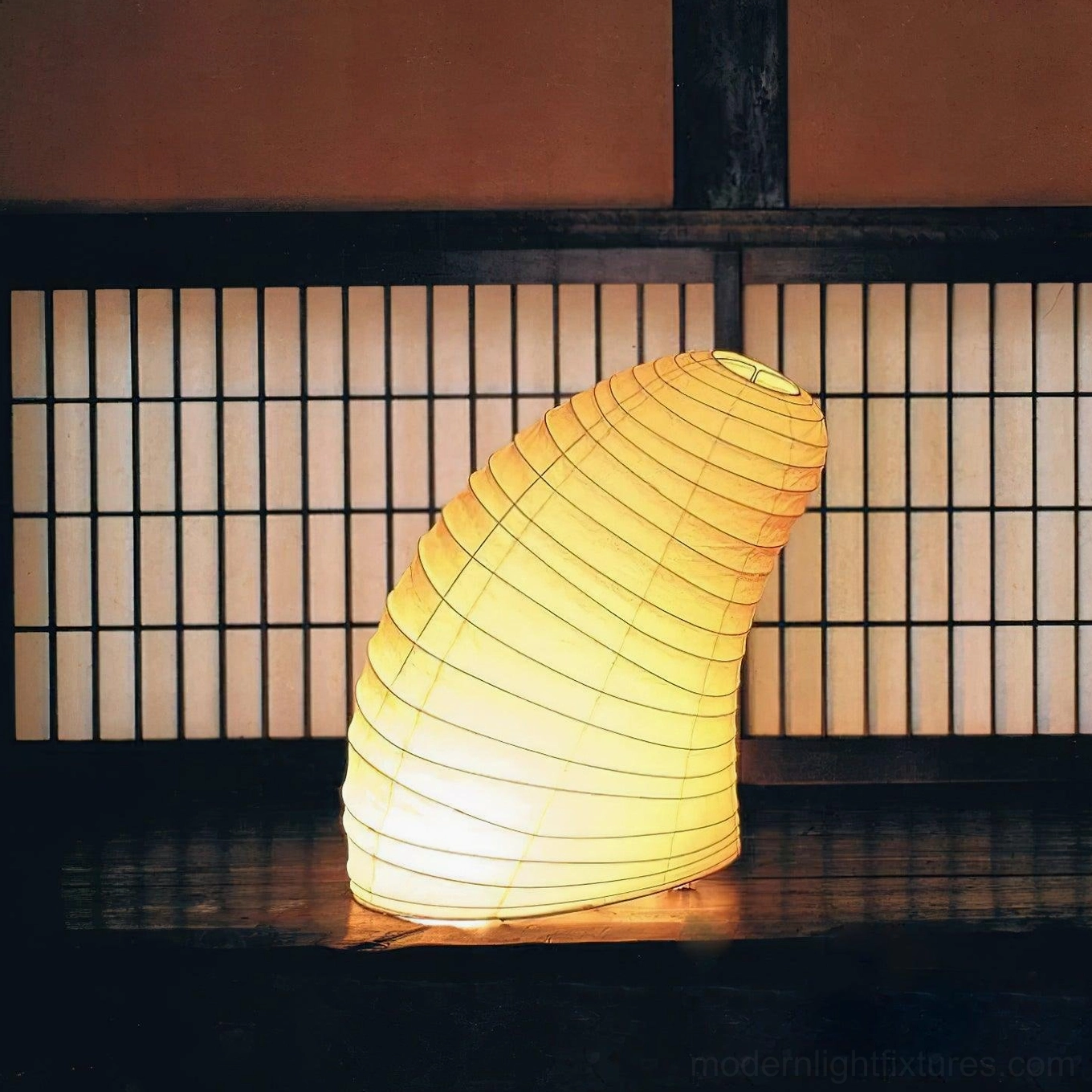 Contemporary minimalist table lamp with ribbed paper shade side profile view studio lighting