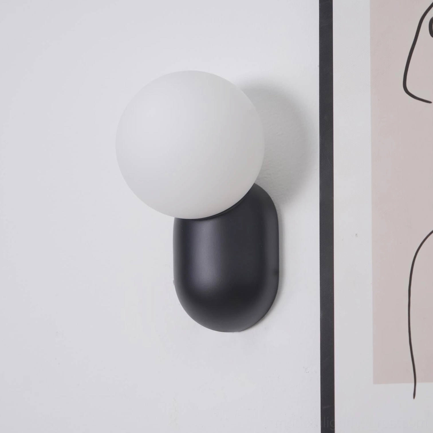 Contemporary minimalist wall sconce rejecting ornamentation through sculptural functional elegance design