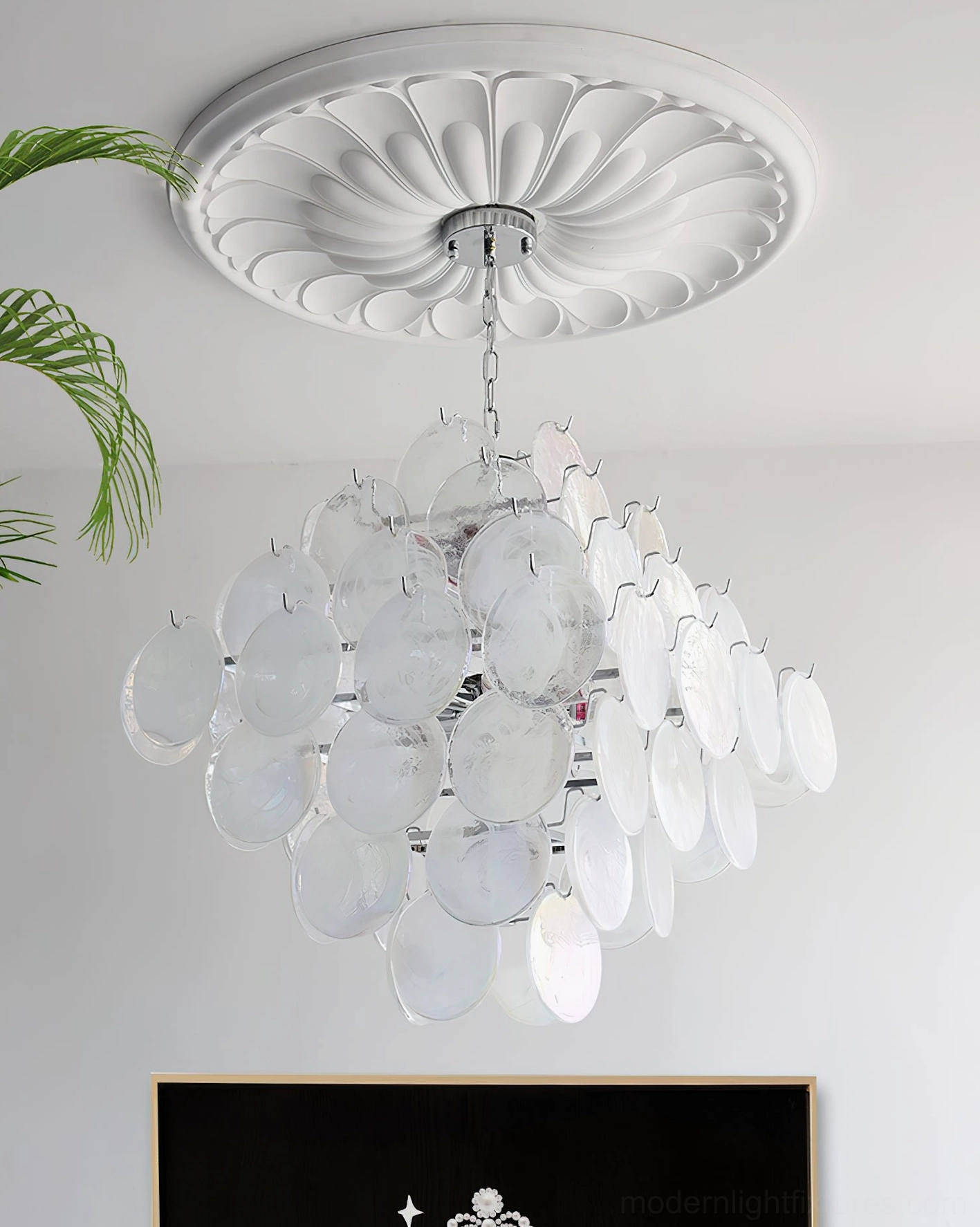 Contemporary Murano glass disc chandelier installed in luxury high-ceiling space with dramatic visual impact
